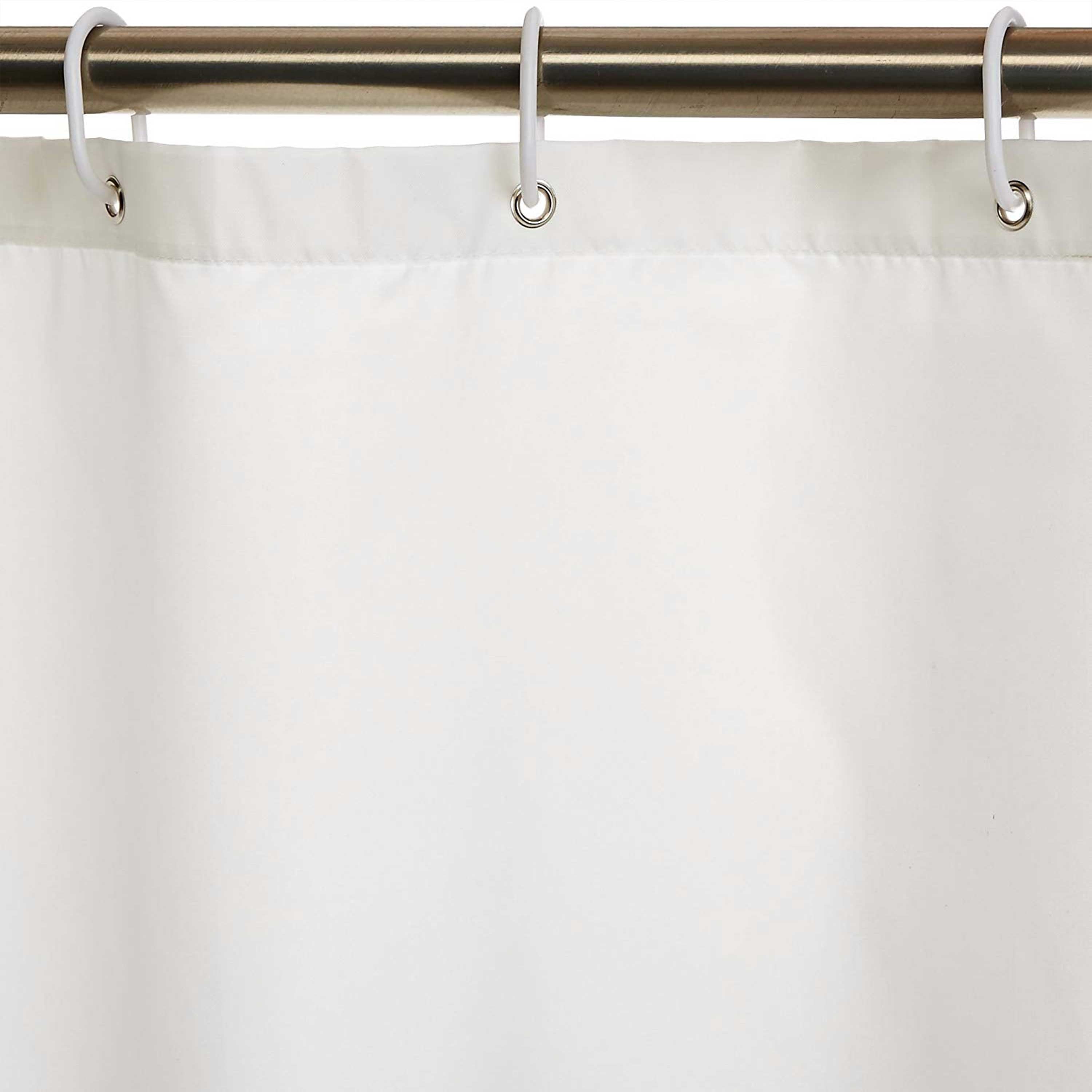 Handcrafted ivory shower curtain made of mold-resistant polyester with a 3” hem, ½” grommets, and a 10-12” custom monogram embroidery.