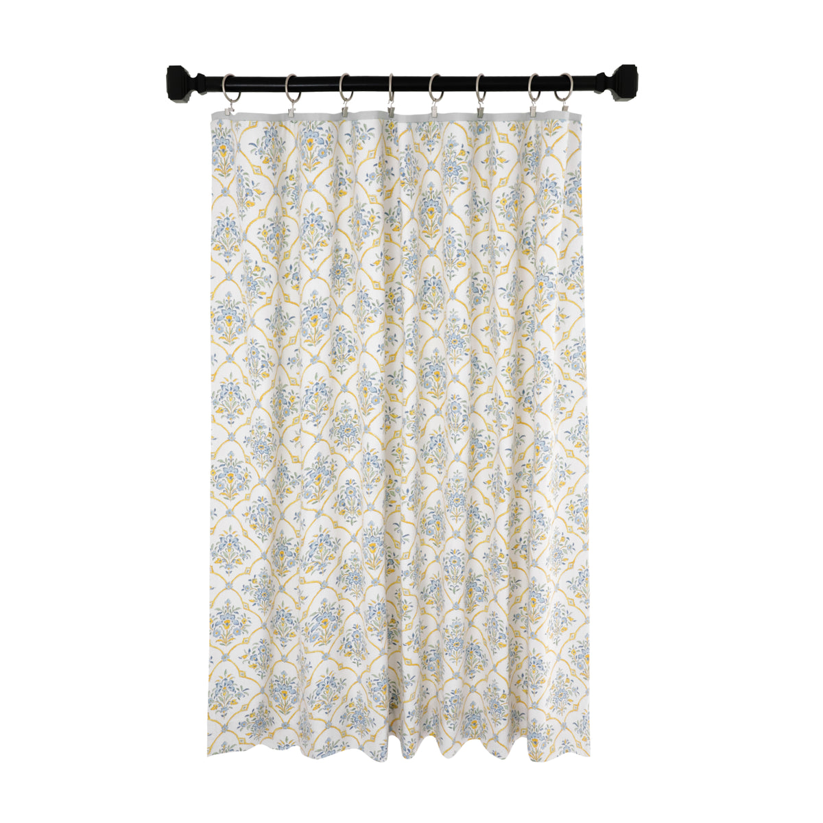 A custom-made floral trellis curtain in a room, with a light gray decorative trim at the top.