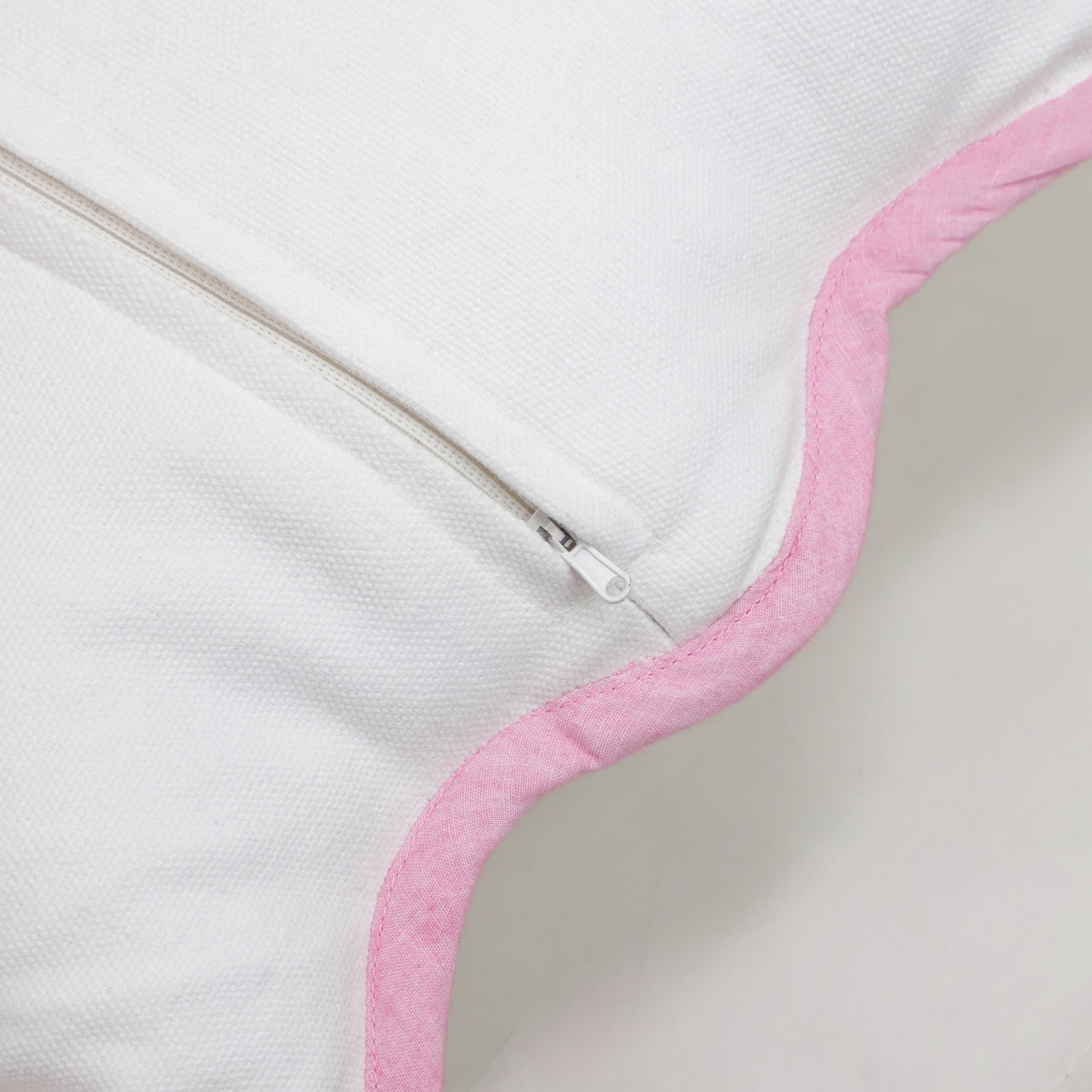The reverse side of the pink scalloped pillow cover showcasing the professional concealed zipper for a seamless, tailored finish. This functional design allows for easy insert removal while maintaining the cushion's clean, modern silhouette. Crafted from premium breathable white cotton with pink tie-dye inspired trim, this durable cover is perfect for everyday use in busy households, nurseries, or curated Airbnb interiors that prioritize both style and practicality.