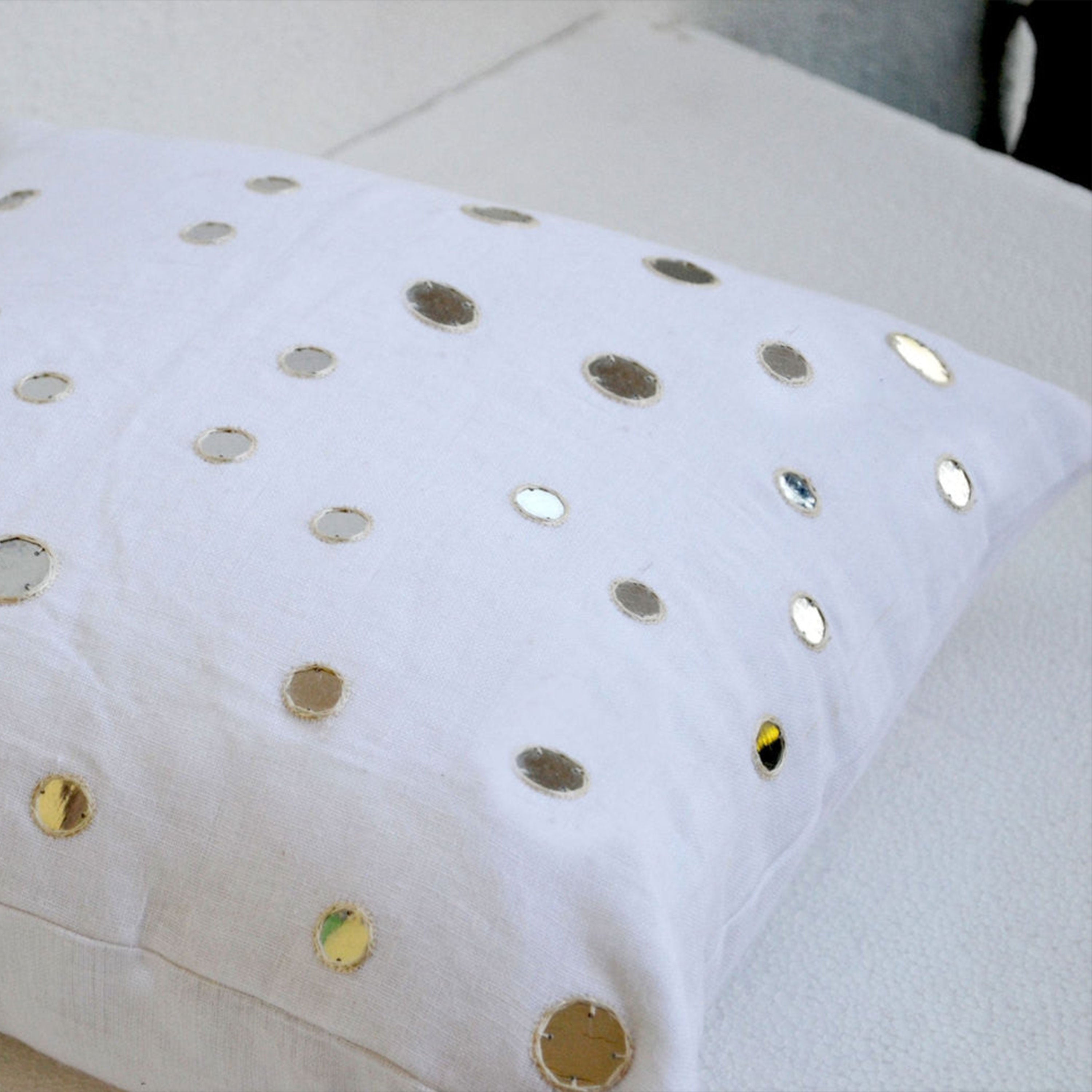 Decorative throw pillows in linen with mirrors