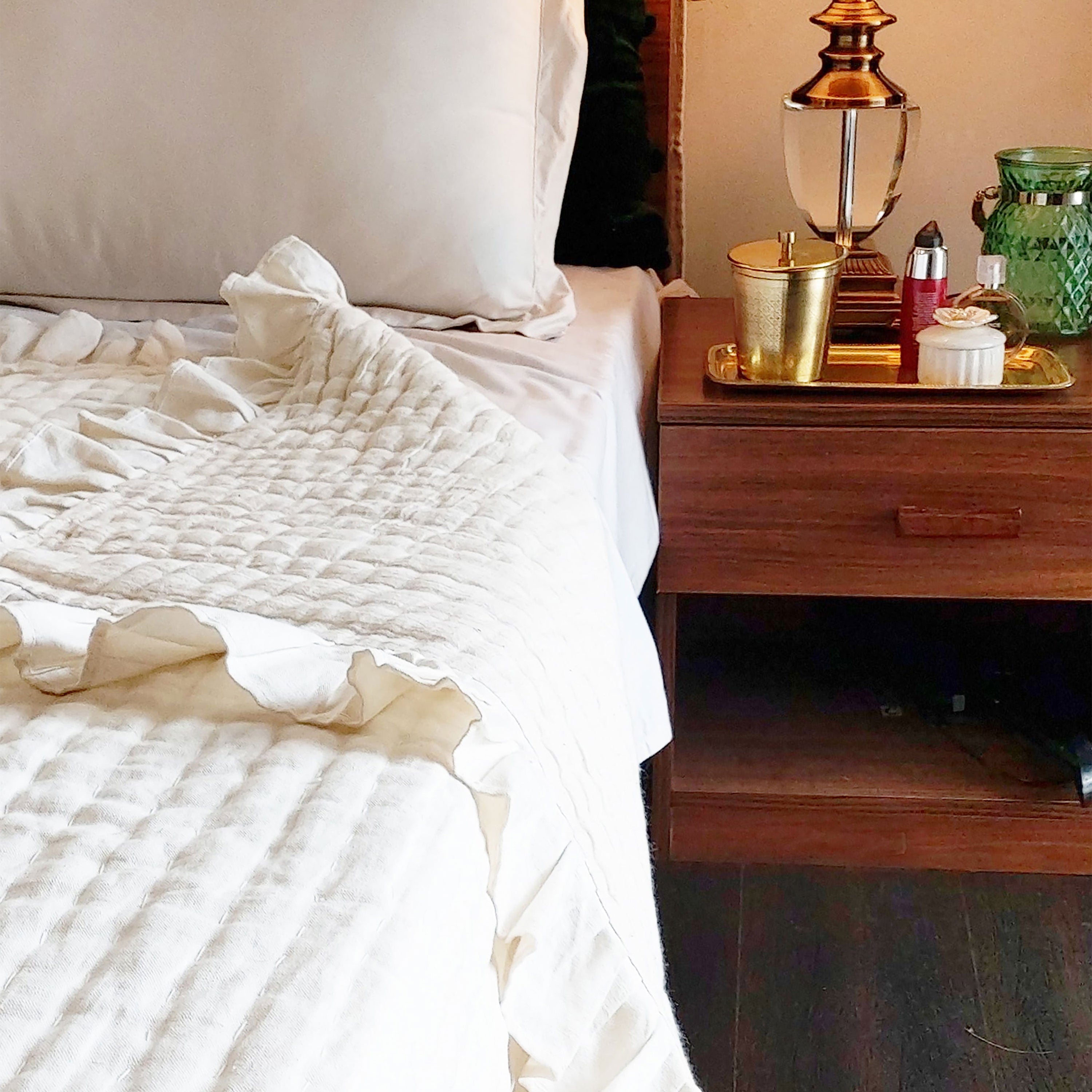 Handcrafted ivory linen quilt, pre-washed with channel quilting for a unique texture, reversible to soft cotton fabric. Perfect year-round comforter.