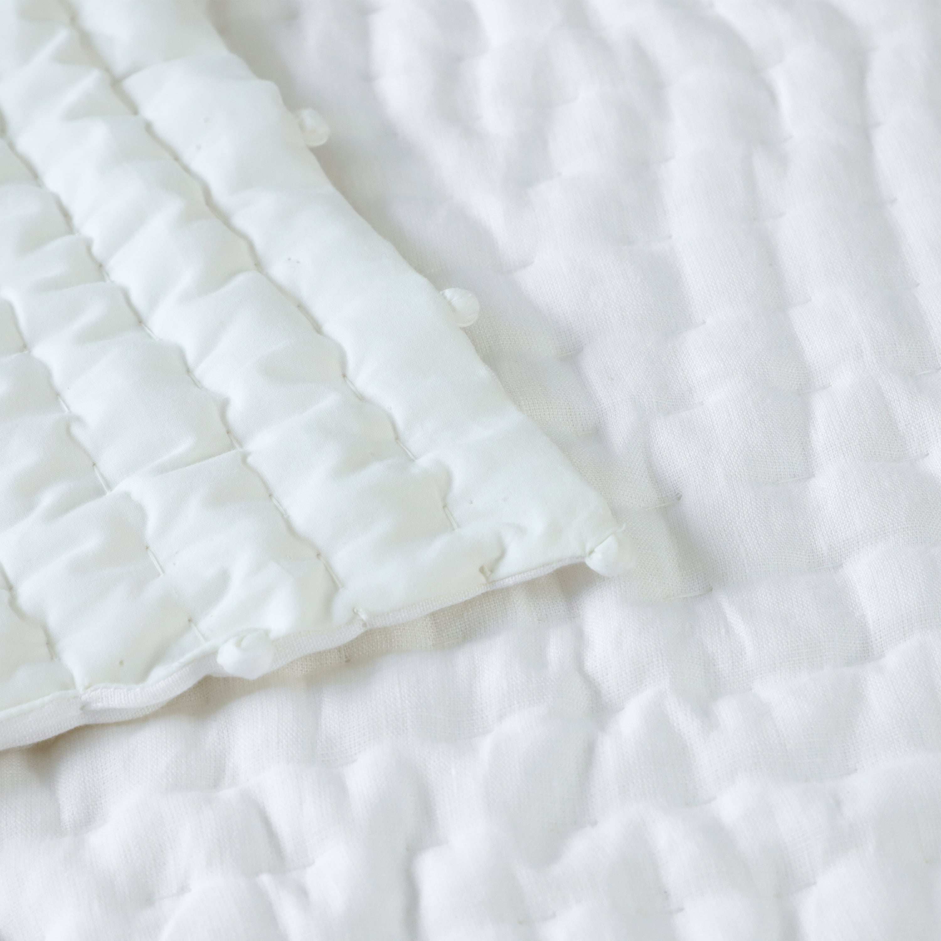Handcrafted pick-stitch quilt stays soft and flawless wash after wash.