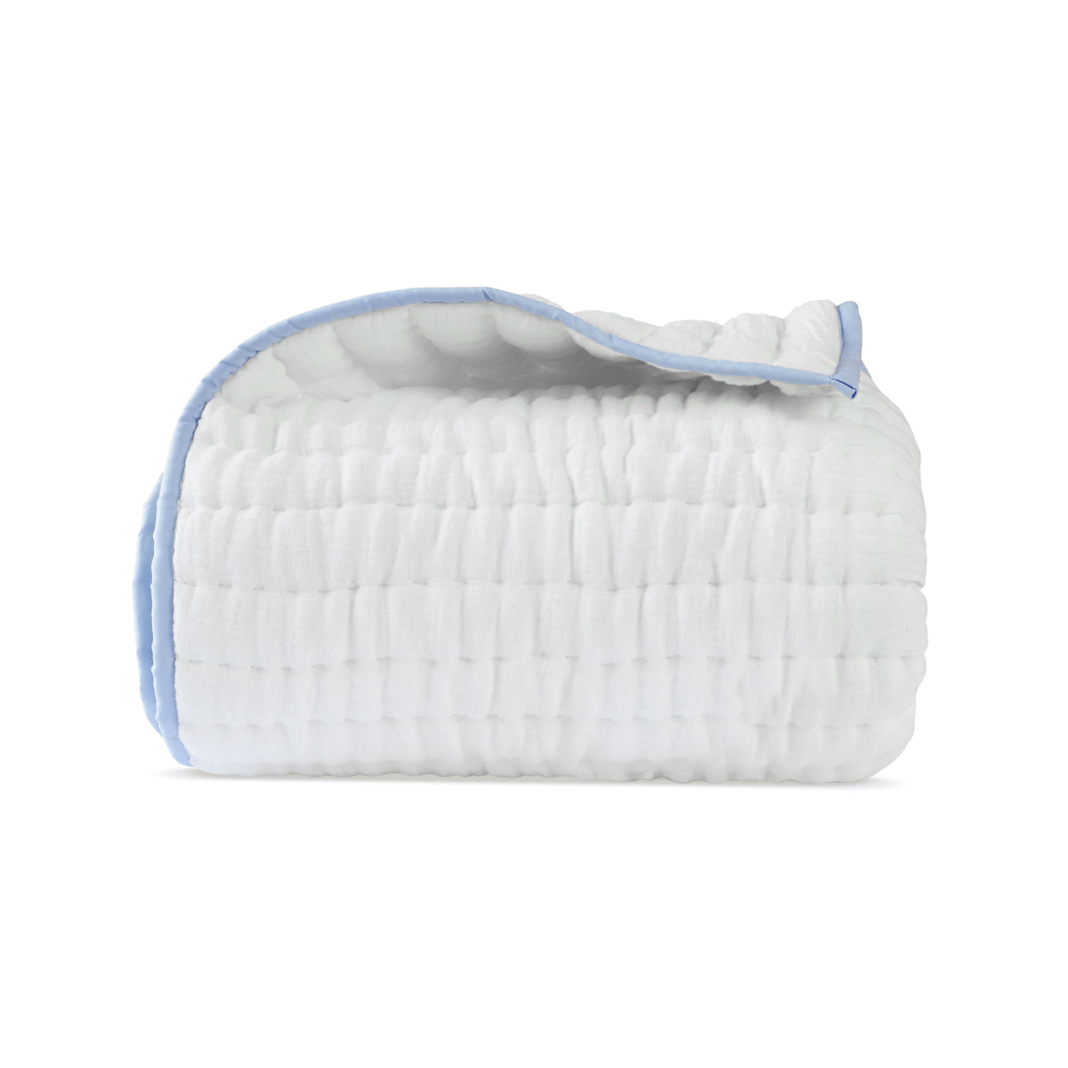 A folded ivory cotton gauze quilt with blue trim on all four sides, displayed against a white background.