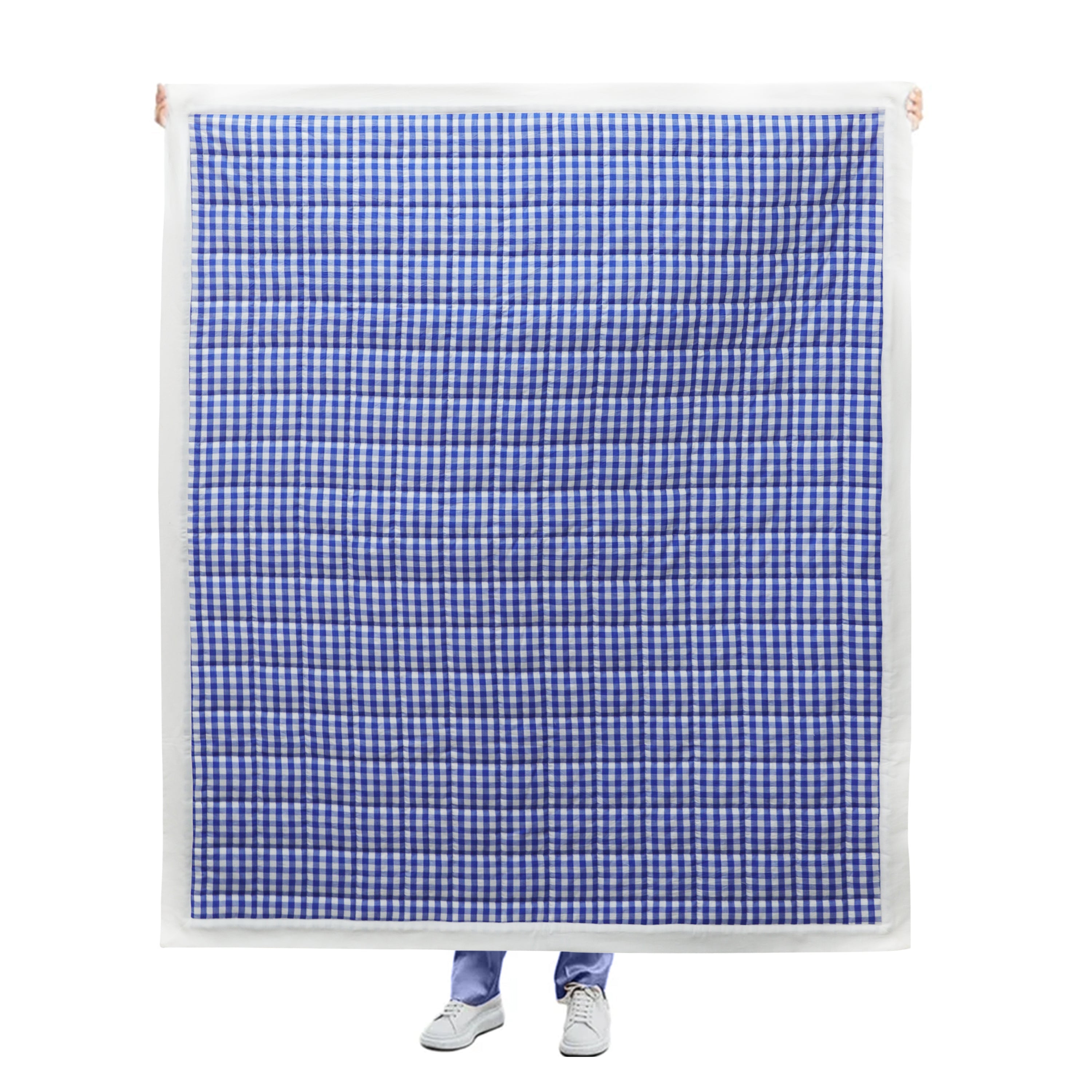 "Handcrafted quilt: This blue and white check quilt features cozy polyester batting, making it easy to wash and perfect for summer or as an additional layer of warmth during colder months."