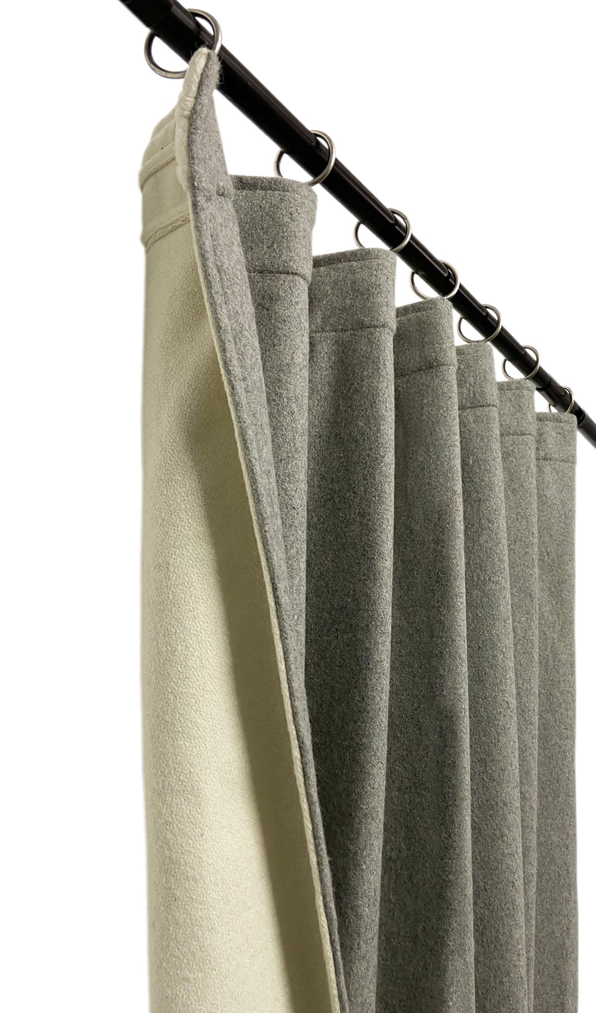 Double-layer wool curtains block up to 99.2% of light and reduce sound by up to 23 decibels. Wool felt is insulating, sound-absorbing, dirt-resistant, and acts as a natural filter. These are versatile. Can be used as curtains, room dividers, accentuating elements, and as wall covering
