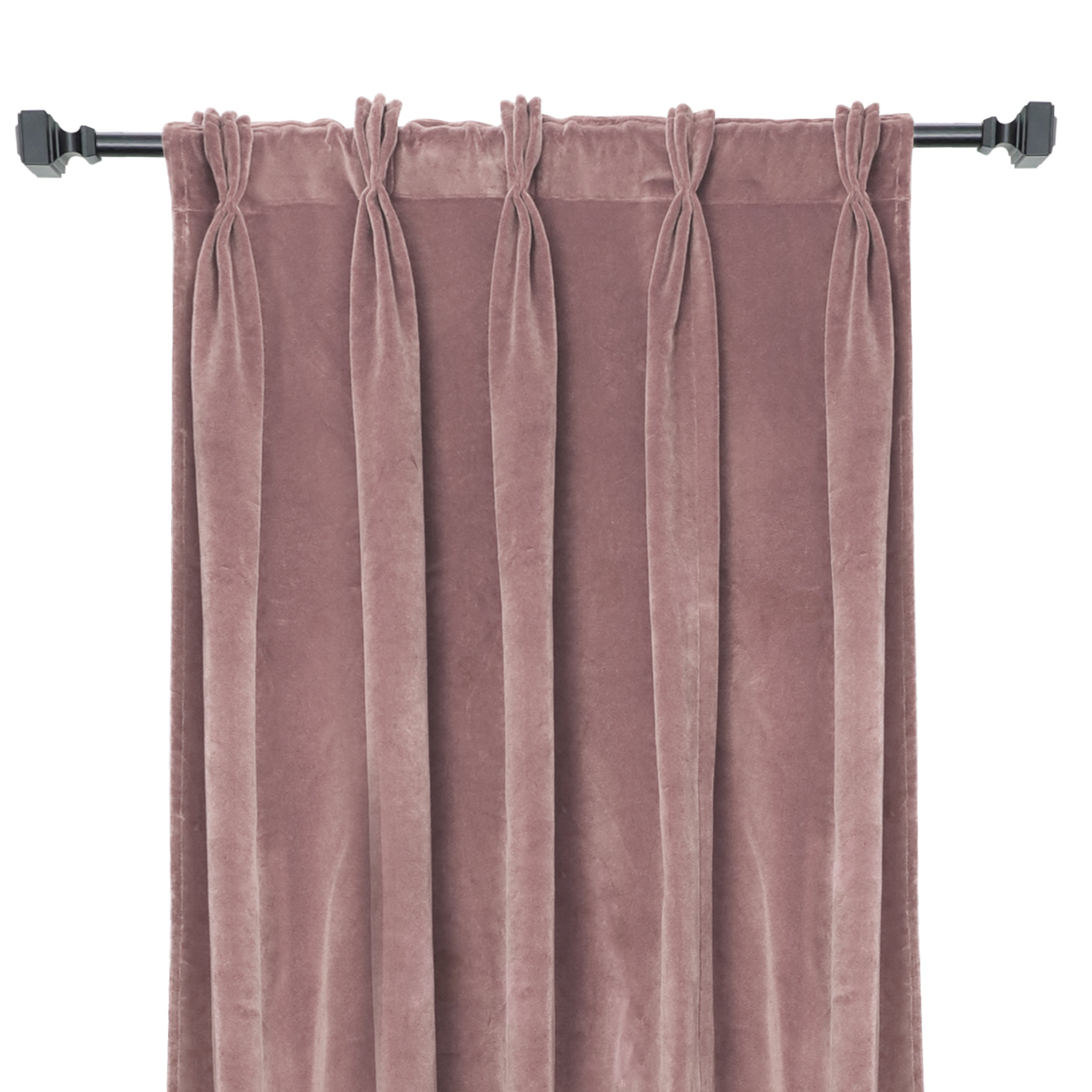 Full view of a single dusty rose cotton velvet curtain panel with structured pinch pleats, hanging from a matte black drapery rod