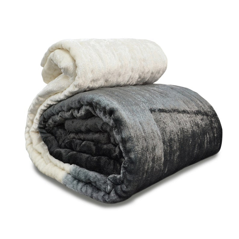 Handcrafted quilt: This gray velvet pick-stitched quilt features an ombre design with soft ivory cotton backing. Light and plush, it's hand-quilted for a unique, textured look.