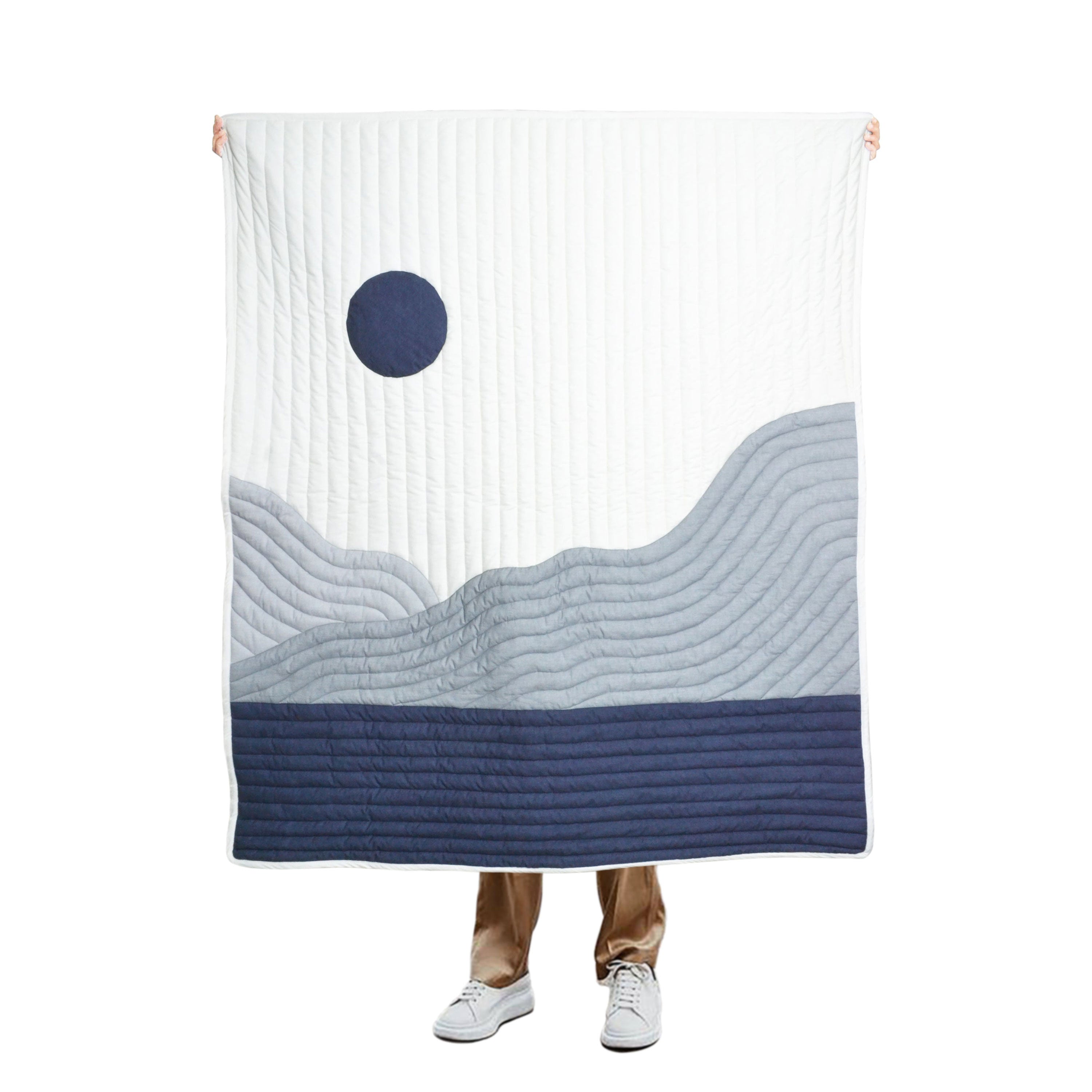 "Traditional hand-worked pick-stitched quilt: The Mountain quilt, inspired by nature, features a mid-century color palette of blues and grays, expertly crafted with machine piecing and hand-stitching techniques for a polished, abstract design."