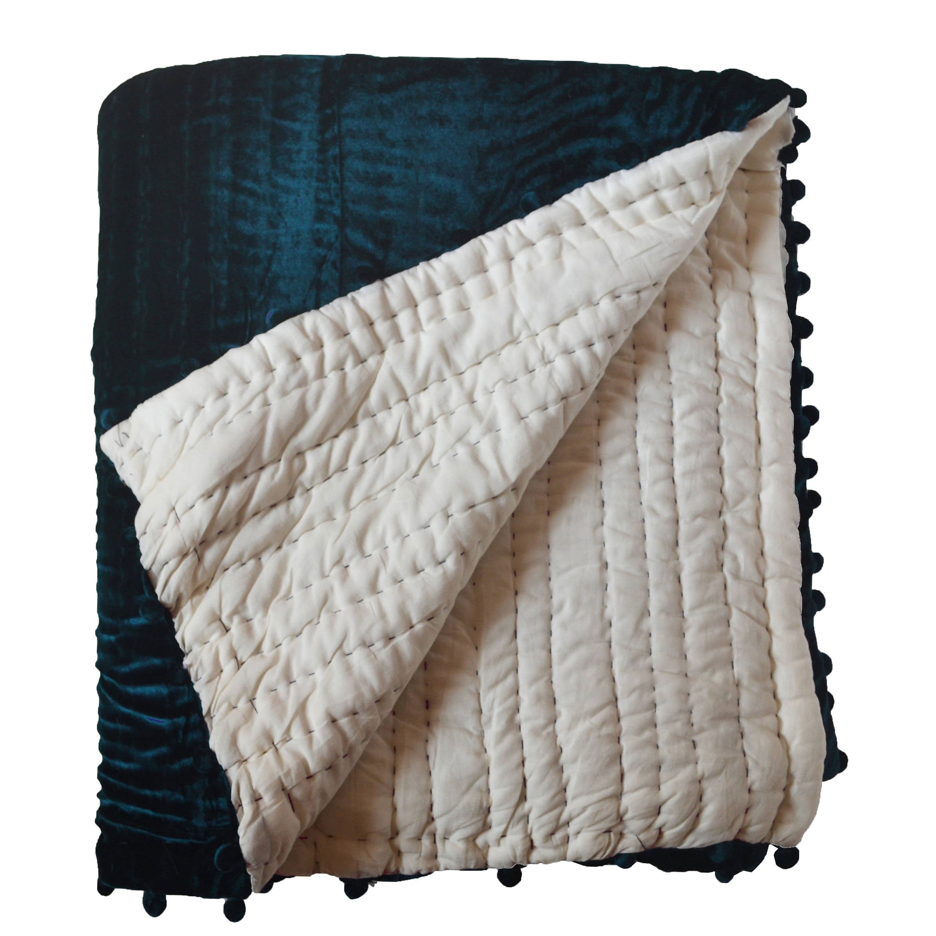 Pick-stitched quilt features soft plush teal velvet on the front, reversing to ivory cotton fabric. Filled with cotton batting and precisely hand-quilted, it offers a unique texture and comfort.