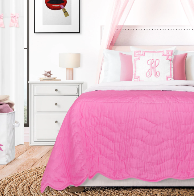 Handmade pink baby blanket on modern kids' bed with accent pillows, reversible cotton quilt, charming nursery bedding for girls, personalized monogram pillow decor.