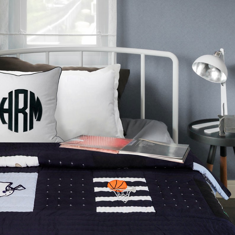 "Handcrafted boys' sports quilt & shams - playful applique details on soft twin or toddler-sized athletic-themed bedding"