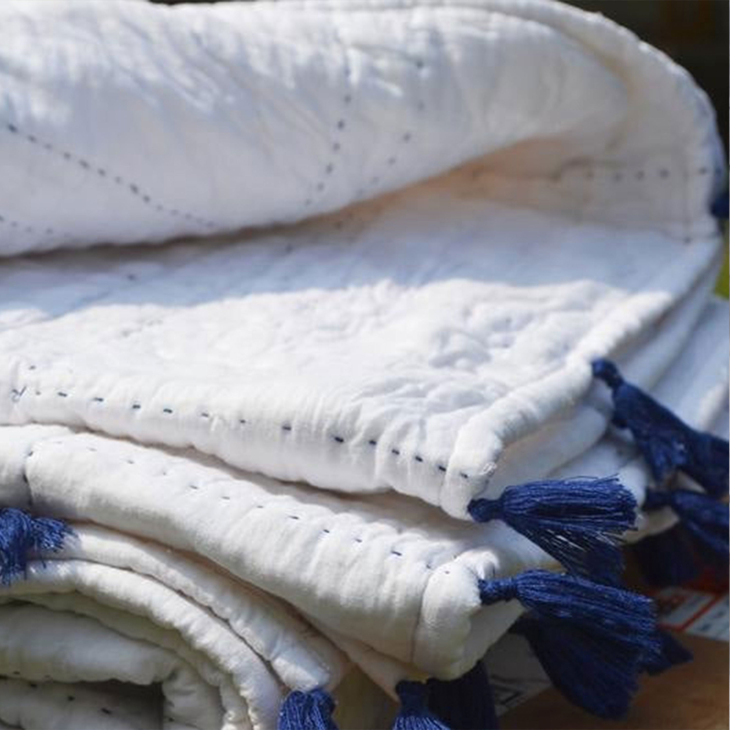 White Cotton Pick Stitch Quilt With Blue Tassels
