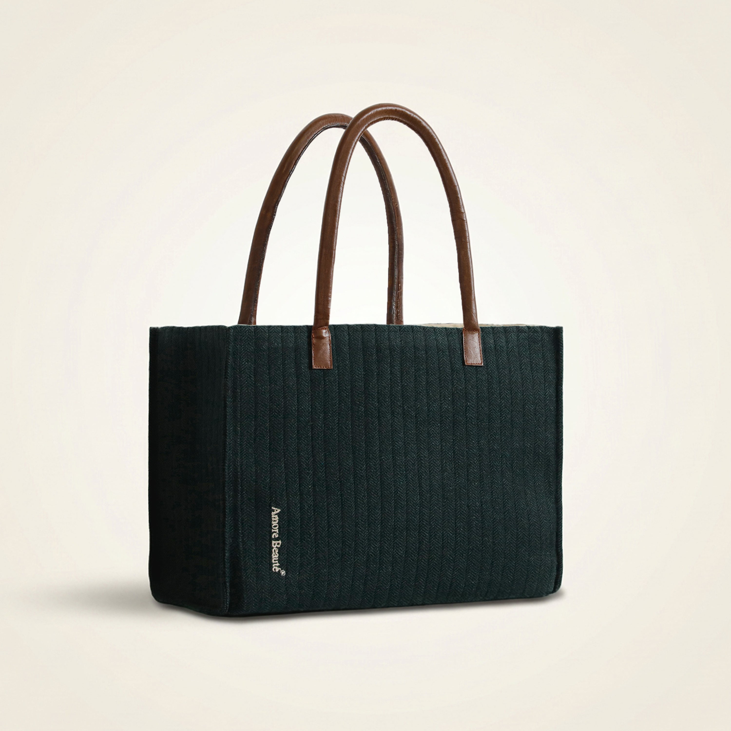 Front profile of the Amore Beauté structured shoulder handbag showcasing the subtle chevron pattern and high-quality textured fabric. Featuring sturdy leather handles for a comfortable grip, this durable forest green tote is a versatile accessory for daily use, shopping, or casual outings. The clean, classic design and subtle branding make it a thoughtful gift for women seeking a chic, professional office bag with a tailored fit.