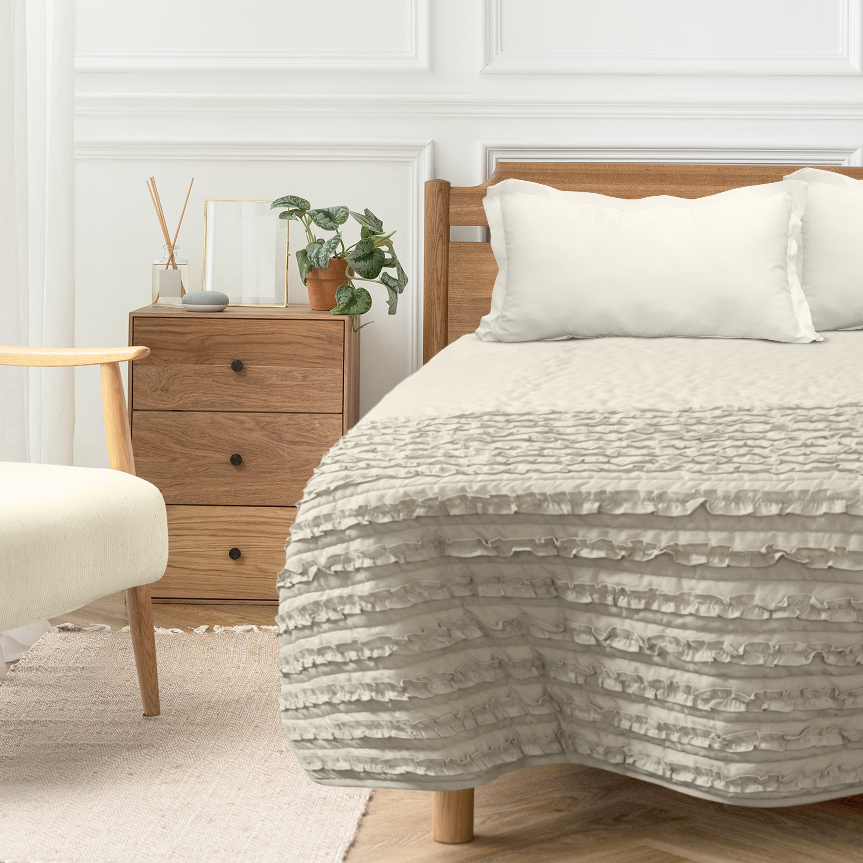 Handcrafted  beige cotton quilt features cute ruffles at the bottom end. Made from the same cotton fabric on both sides, this ruffle coverlet offers a soft and stylish addition to any bed.