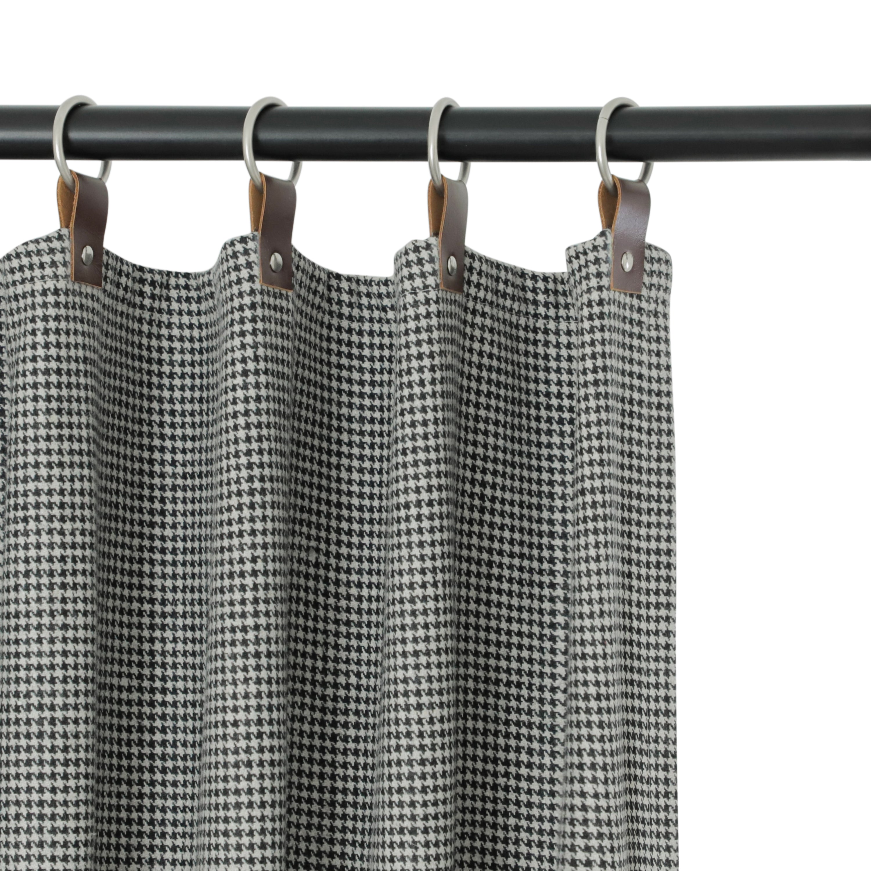 "Handcrafted wool felt houndstooth curtains in black & grey. SPF 50+ UV protection, energy-efficient, and customizable light control. Perfect for windows and doors."

