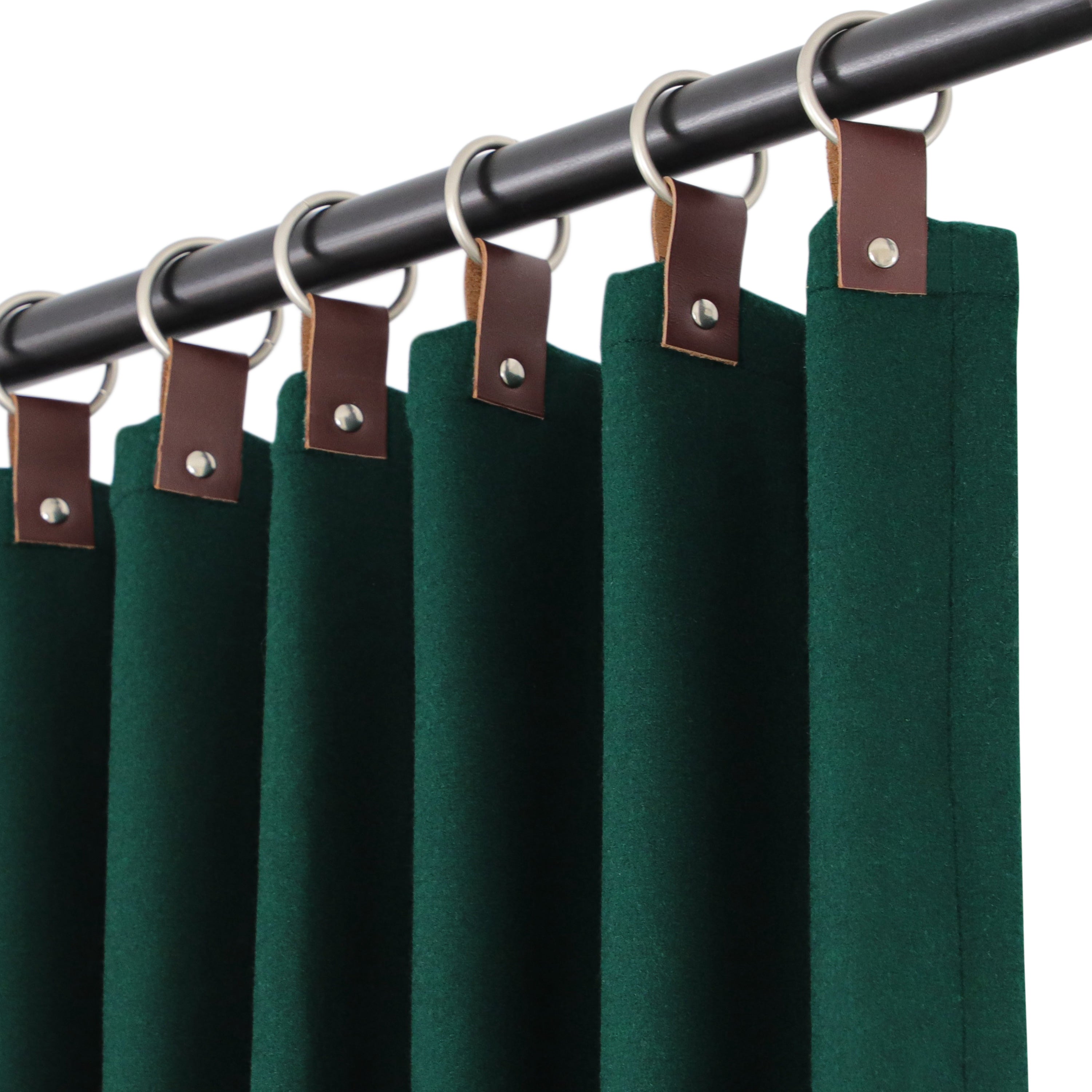 Dark green wool felt curtains with genuine leather tabs are expertly crafted from premium-quality fabric, adding warmth and elegance to your room décor.