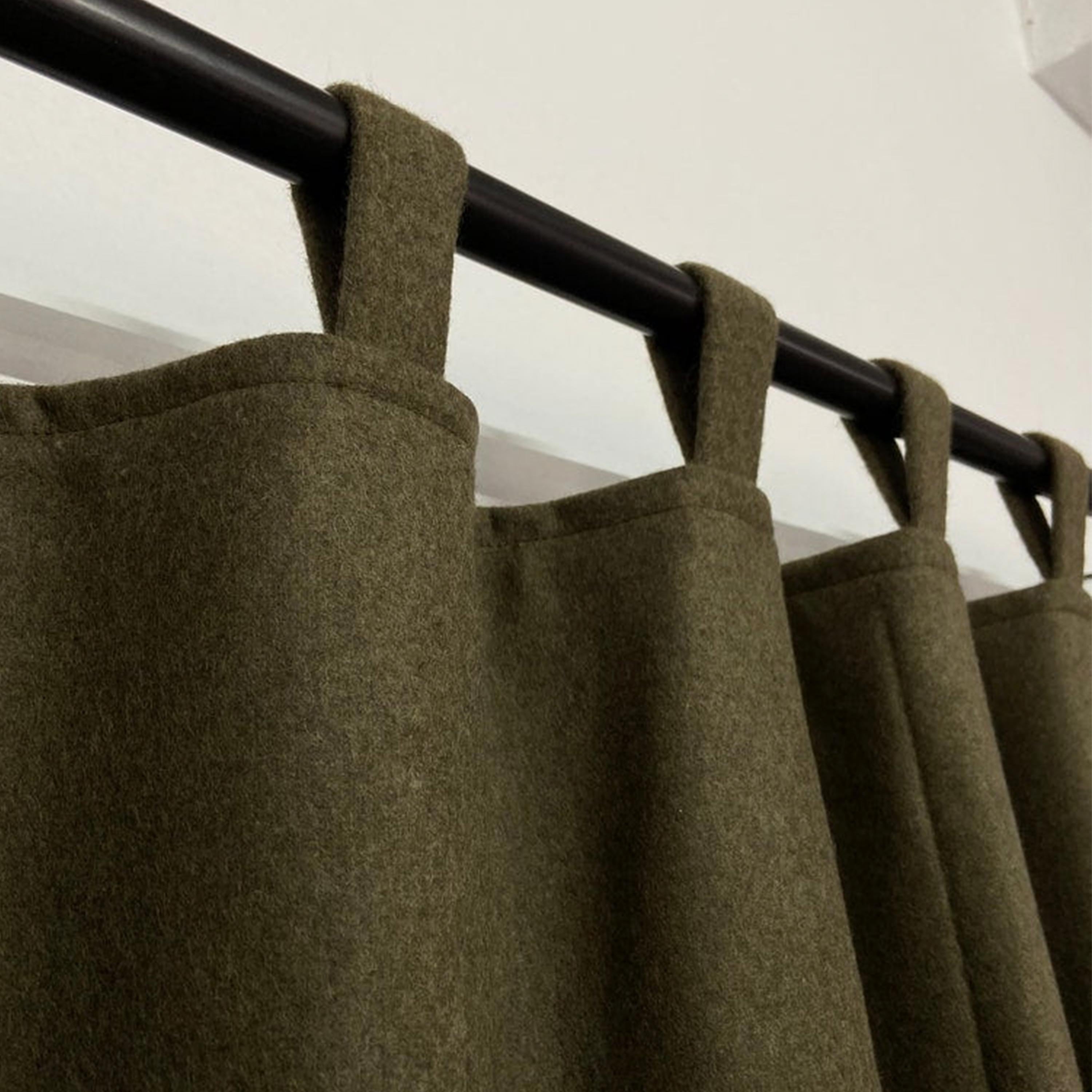 These custom-made door curtains are crafted from a recycled wool blend, providing a sustainable and eco-friendly option. Made without any VOCs, they offer a healthier choice for your home decoration.