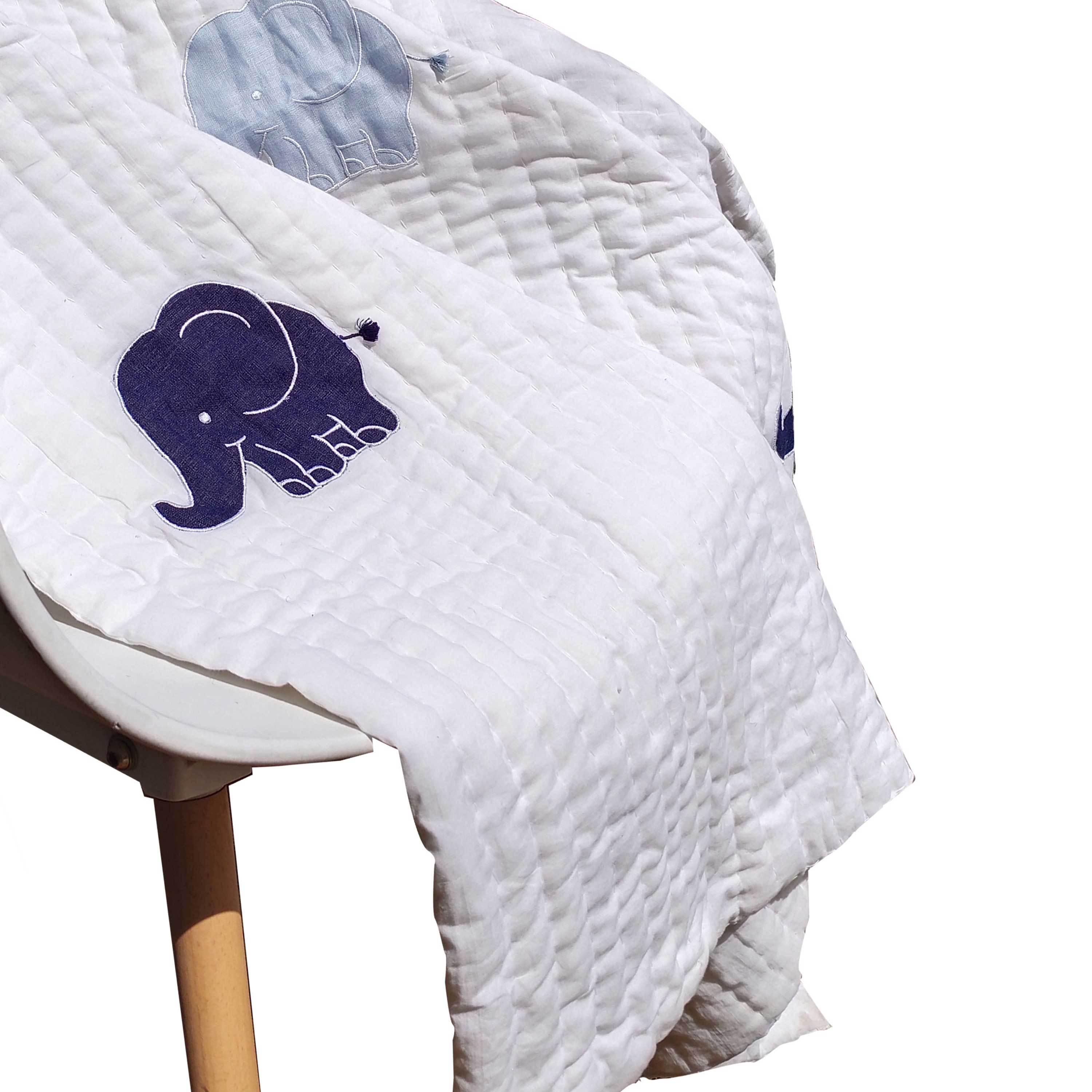 Traditional hand-quilted quilt features an elephant design in white and blue, offering an instant heirloom appeal. Perfect as the centerpiece of your nursery or kid's room.