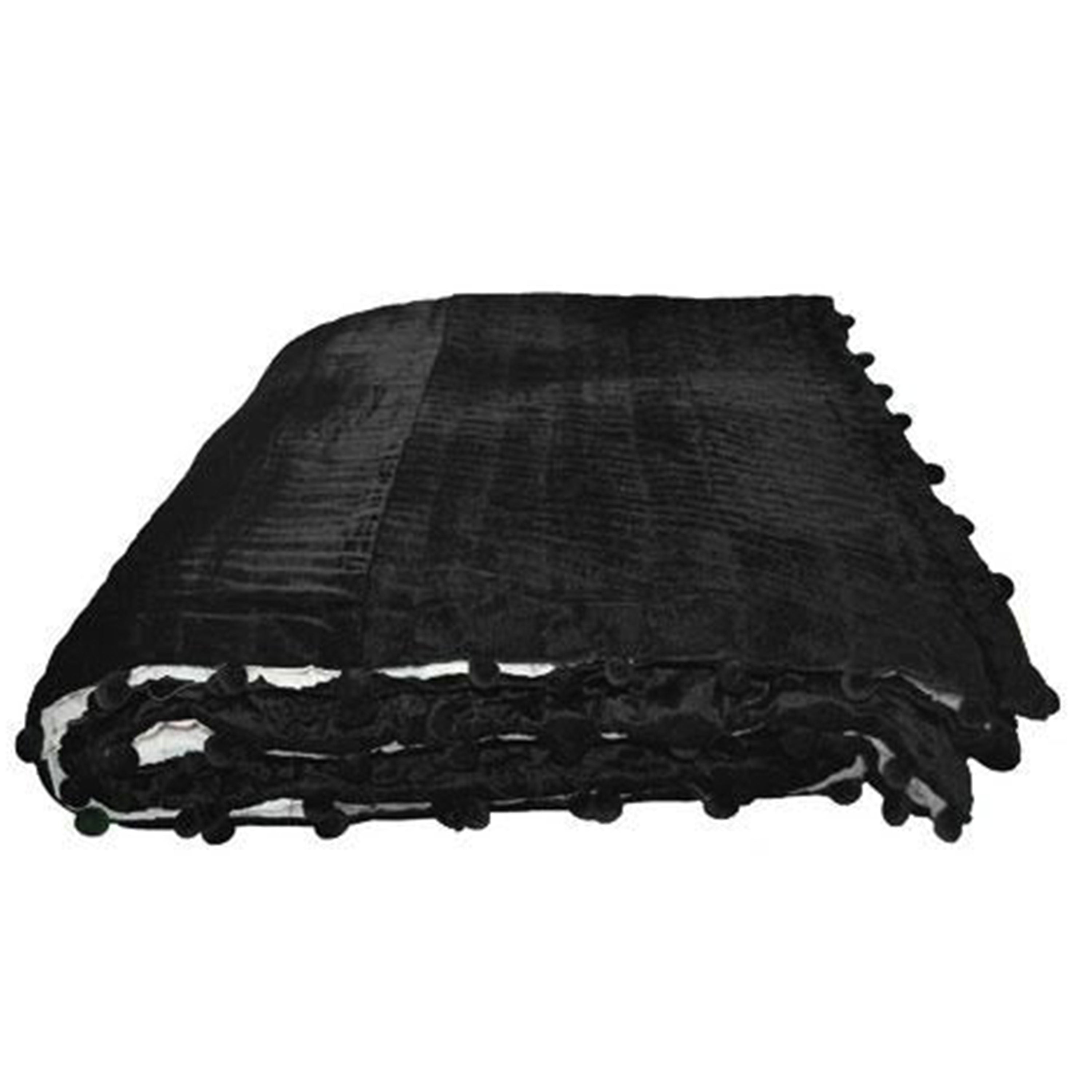 "Handcrafted from soft plush black velvet, this quilt is a popular color choice. It reverses to equally soft off-white cotton fabric, offering both comfort and style."