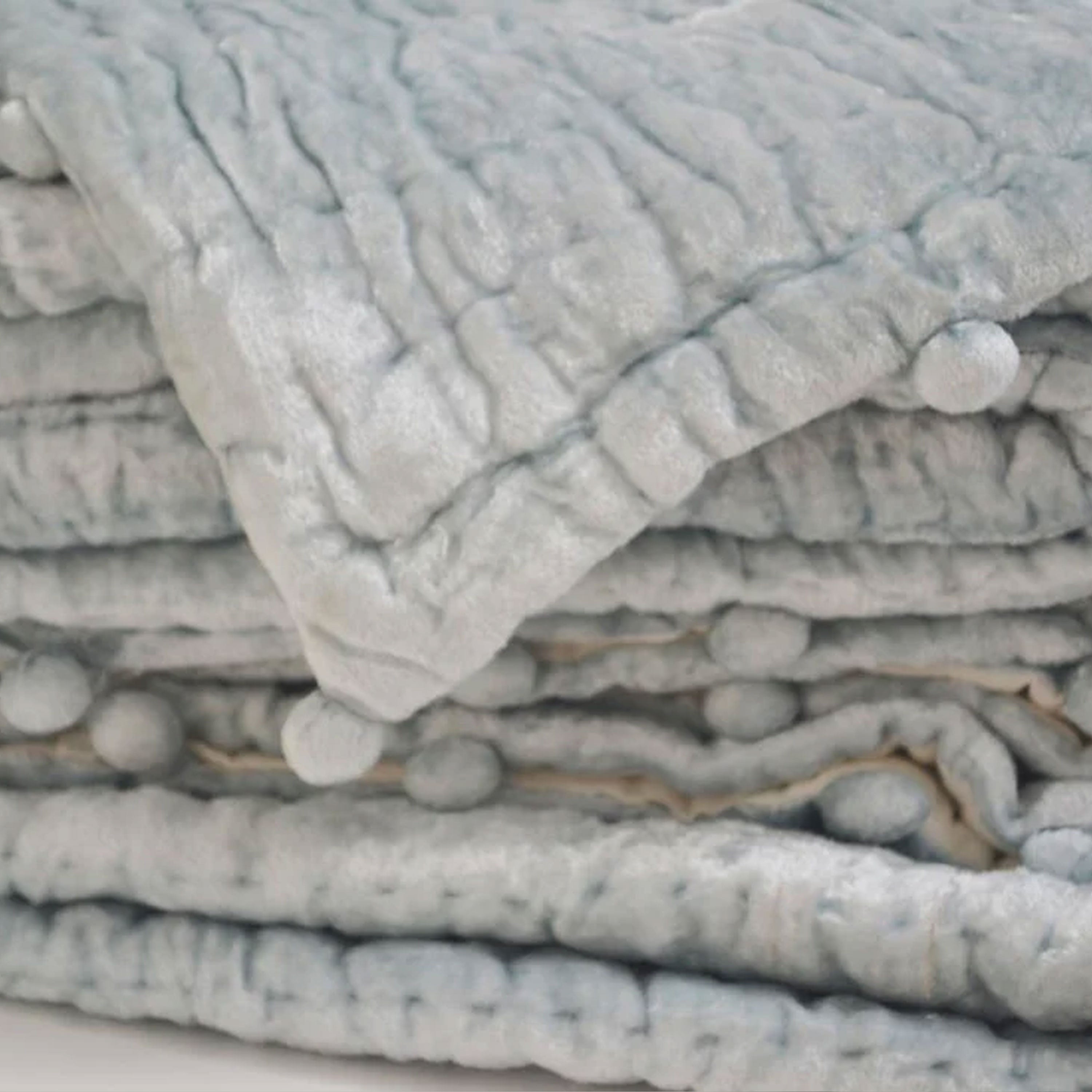 Hand quilted for a unique texture and tonal look, this pre-washed cozy velvet quilt offers a natural, soft finish. Versatile in function, it can be used as a bedspread, coverlet, or blanket year-round.