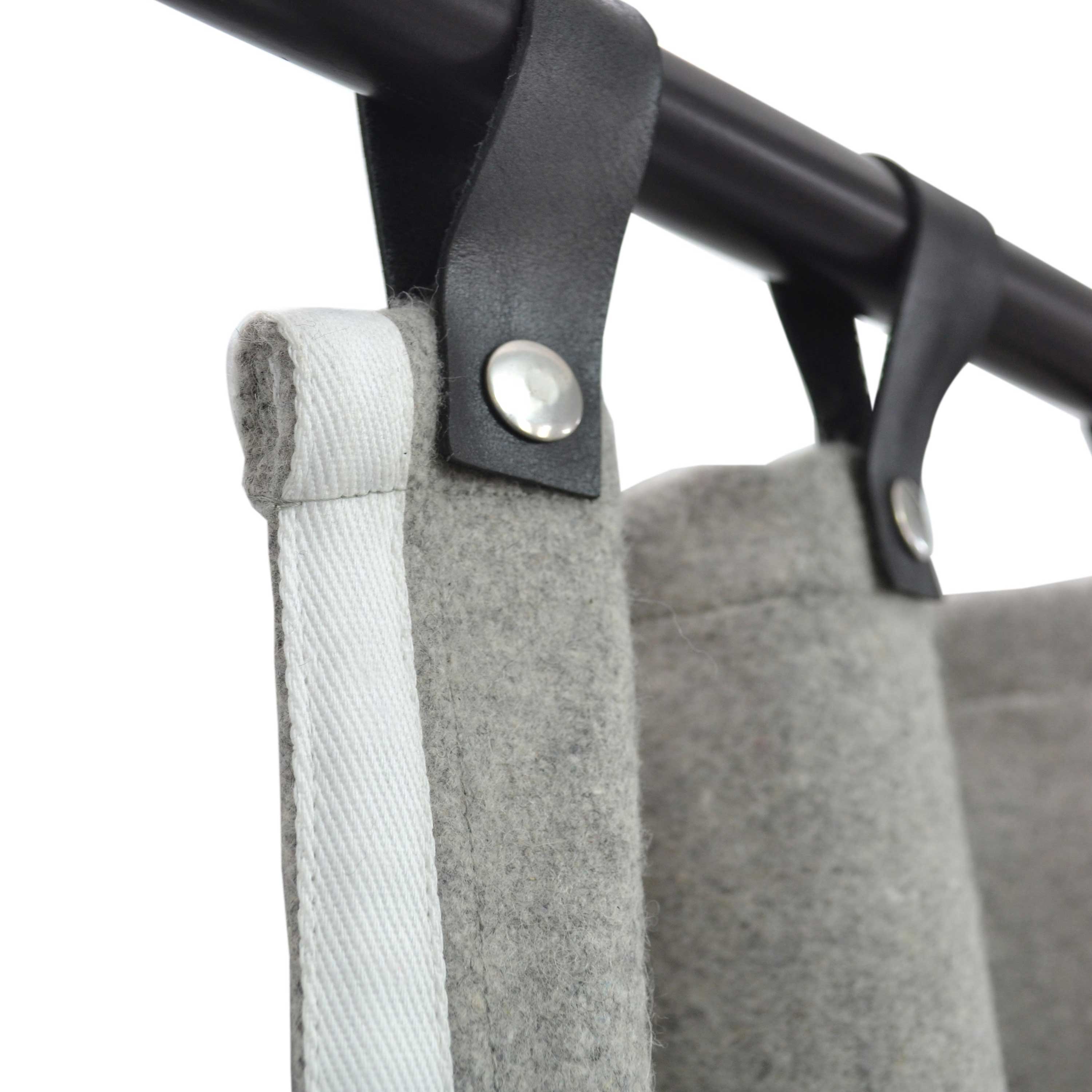 Custom made  curtain fashion gets a boost with these light gray wool felt curtains with white trim. Crafted from high-quality fabric, the unique leather tabs with snap buttons add a modern, industrial style to your room decor.