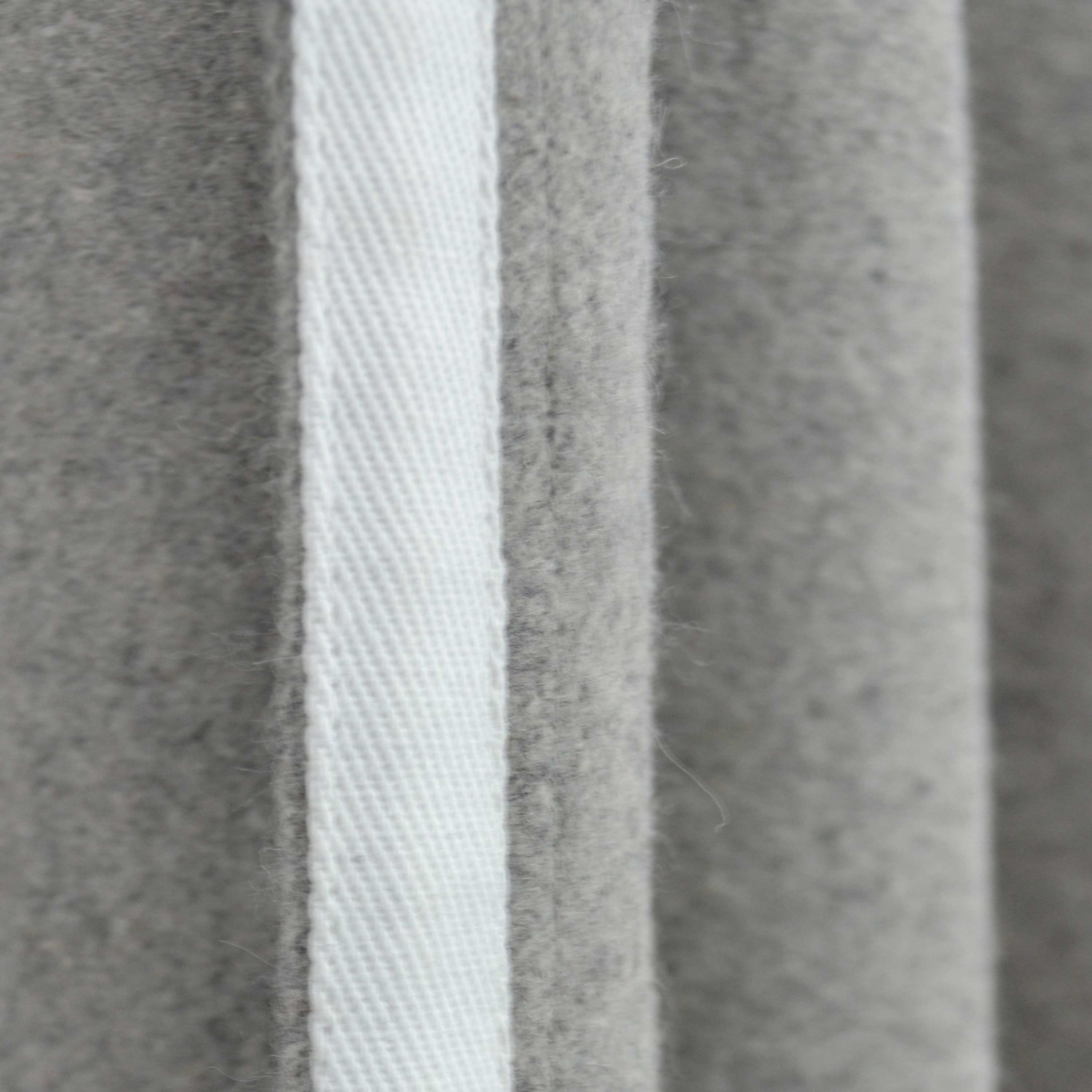 Wool fabric is a natural insulator, effectively blocking drafts in the winter and heat in the summer. It also reduces noise, with double-layer wool curtains reducing sound by up to 23dB.