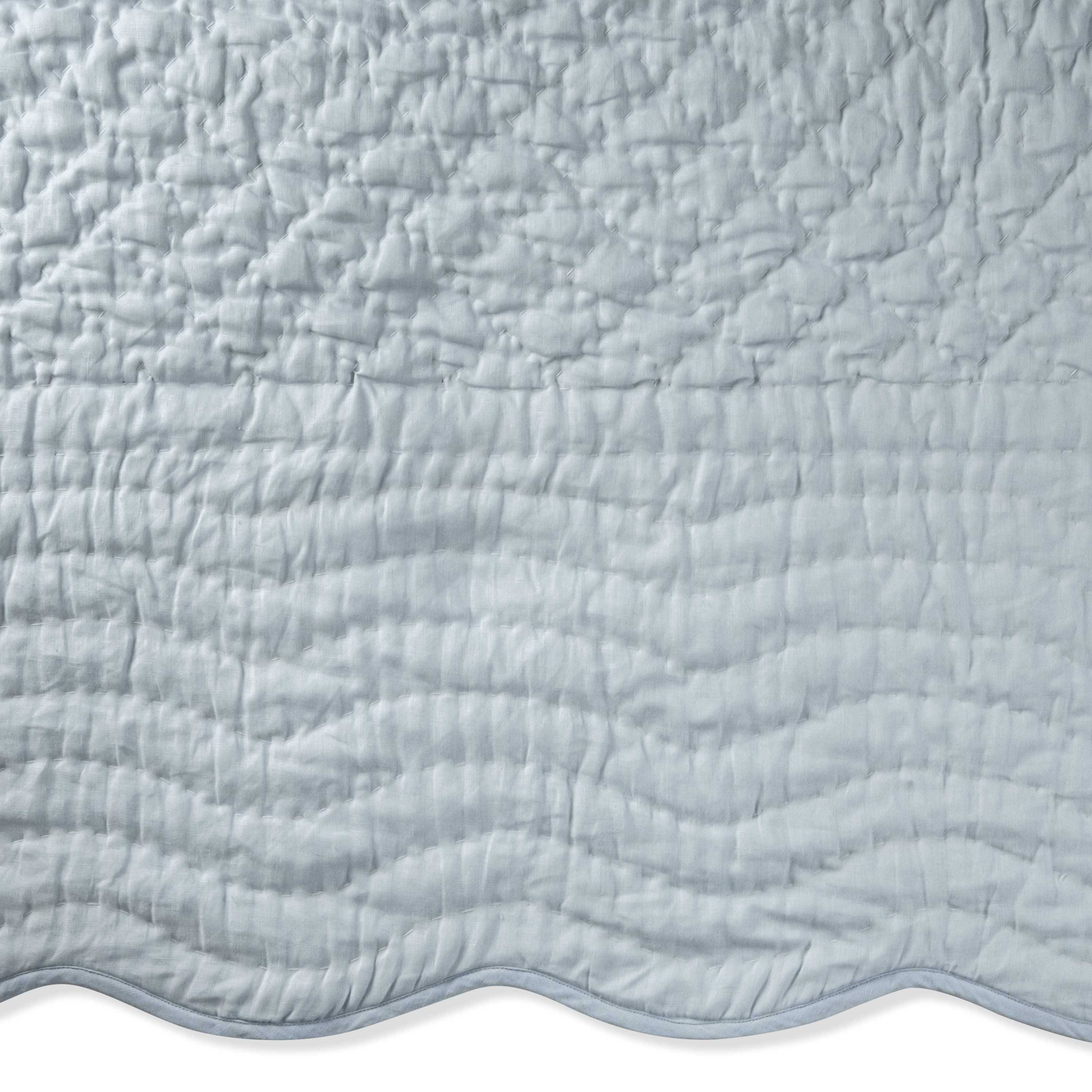 linen quilt features ivory linen on top, reversing to soft cotton voile, with moisture-wicking cotton batting for added softness and comfort. Machine washable on a gentle cycle.