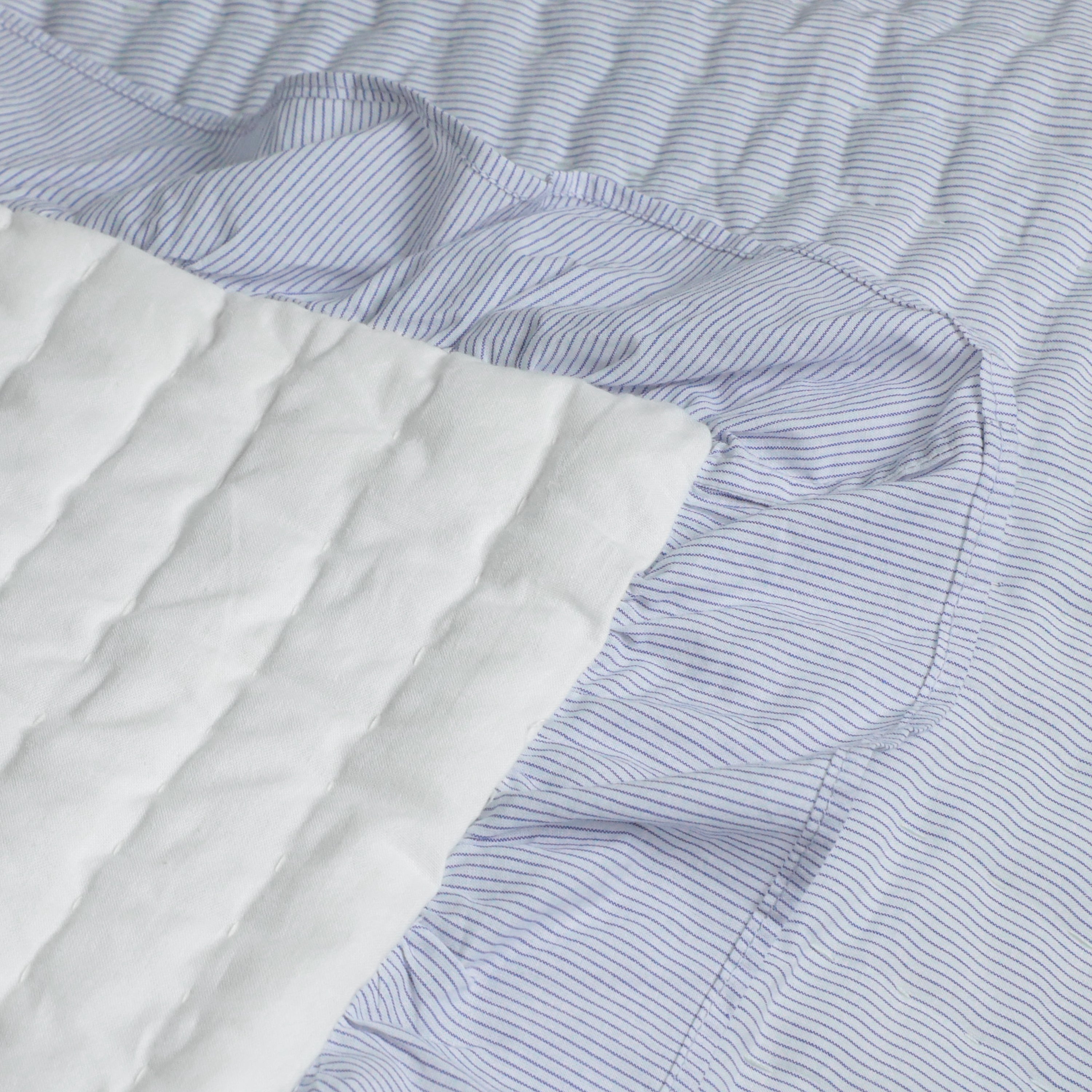 Made to order  with cotton fabric on both sides, the quilt reverses to plain ivory cotton voile and is filled with soft cotton batting.