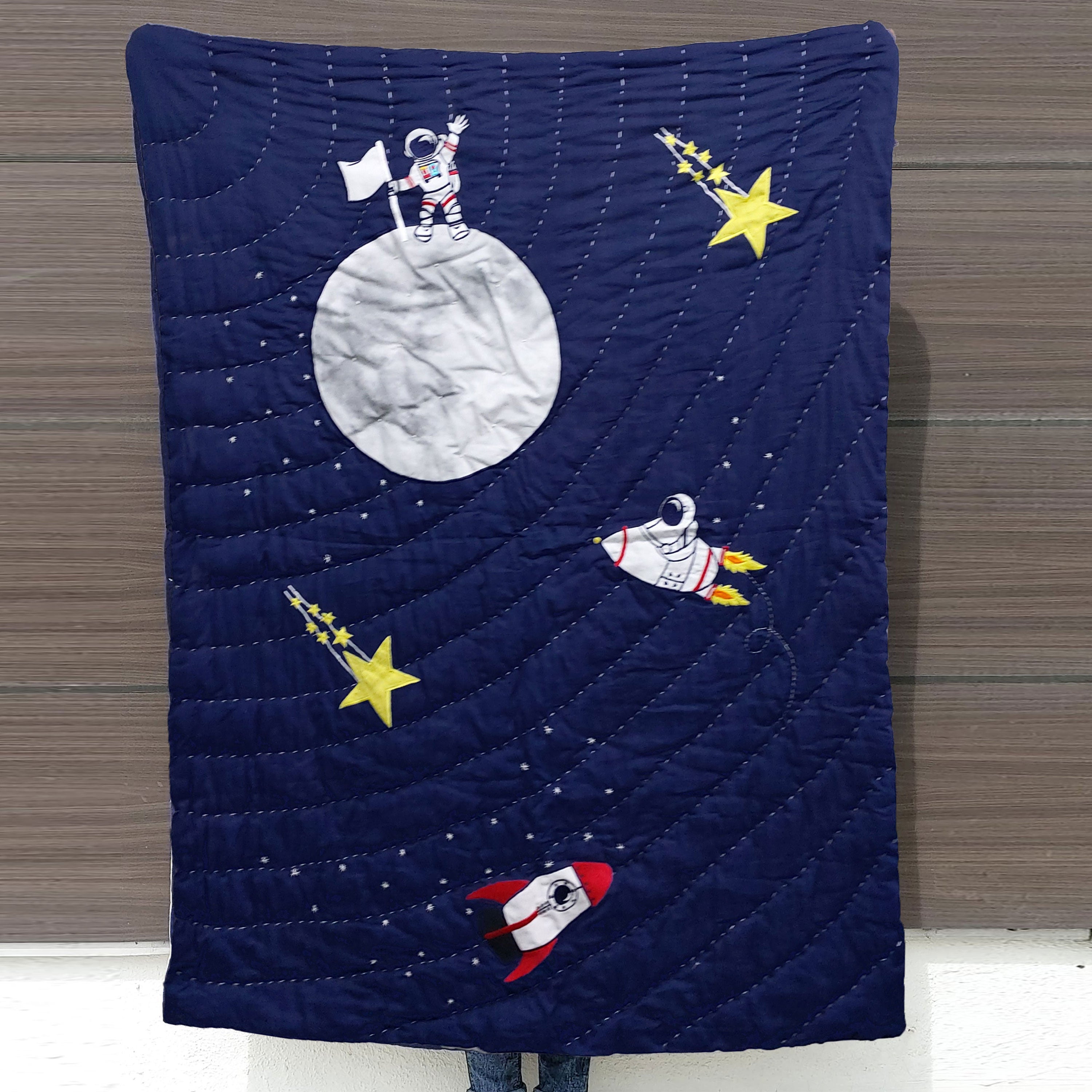 "Made-to-order Outer Space boys' quilt celebrates the adventure of exploring new planets, making it the perfect centerpiece for your nursery or kid's room."