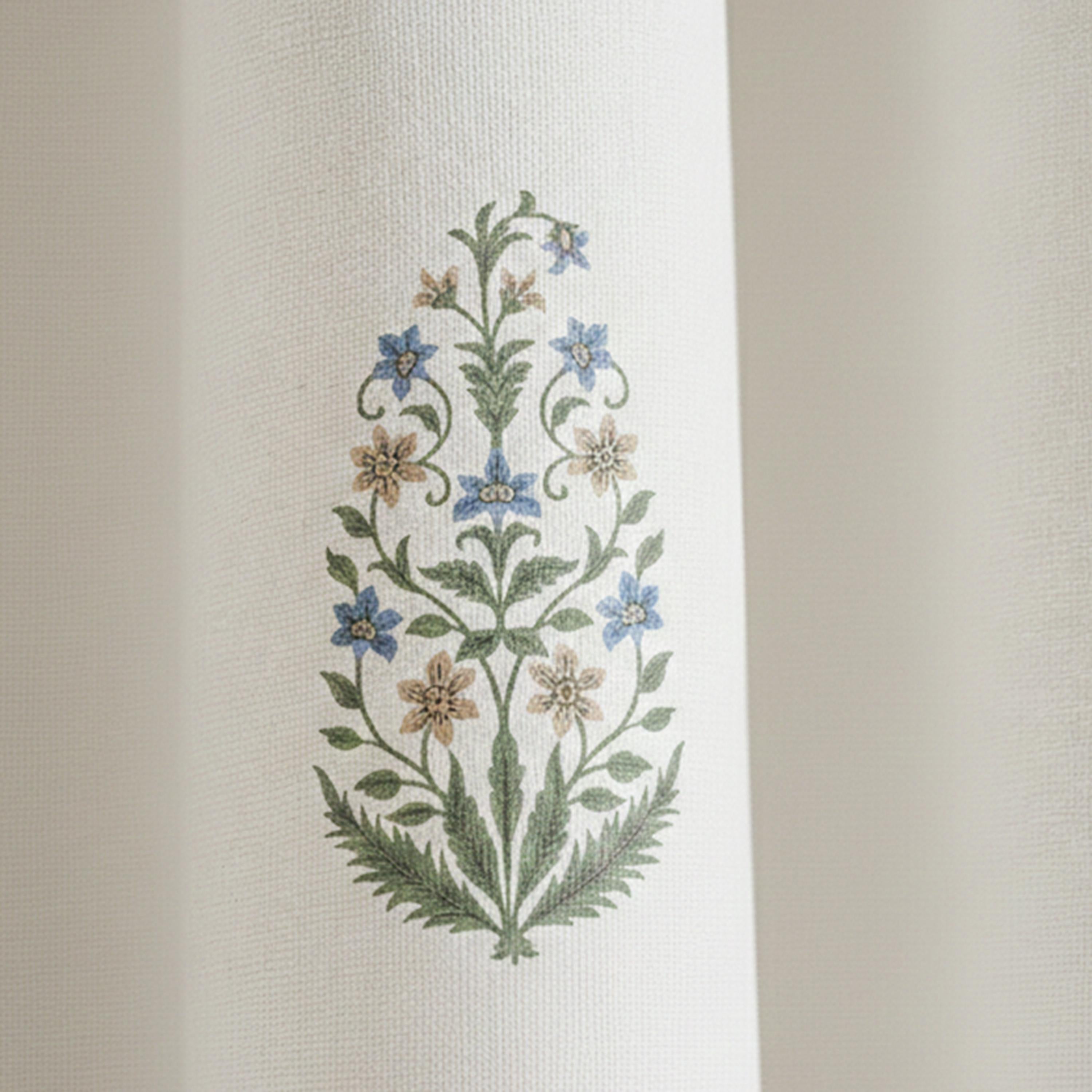 Close-up of a traditional block print floral pattern professionally printed on off-white cotton canvas fabric. This high-detail shot highlights the consistent pattern clarity, colorfastness, and fade-resistant quality of our designer curtains. The artisanal blue and tan botanical motif is evenly distributed, making these drapes ideal for interior designers seeking a refined, timeless look for nurseries or rustic spaces. Durable, high-quality textile detail from Amore Beauté.