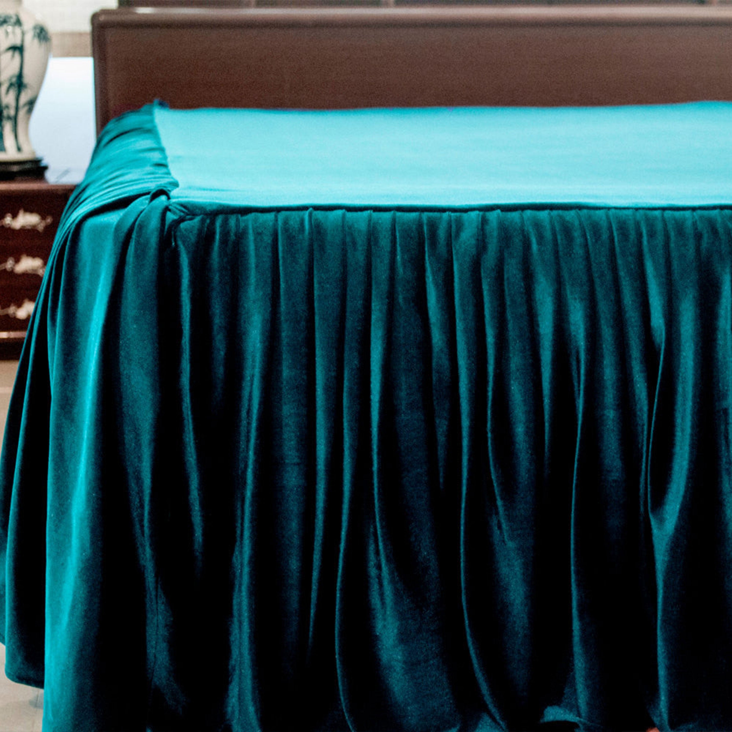 Traditional hand-worked pick-stitched quilt: This teal velvet bedspread features a charming ruffle design, crafted with intricate hand quilting for a unique and elegant finish.