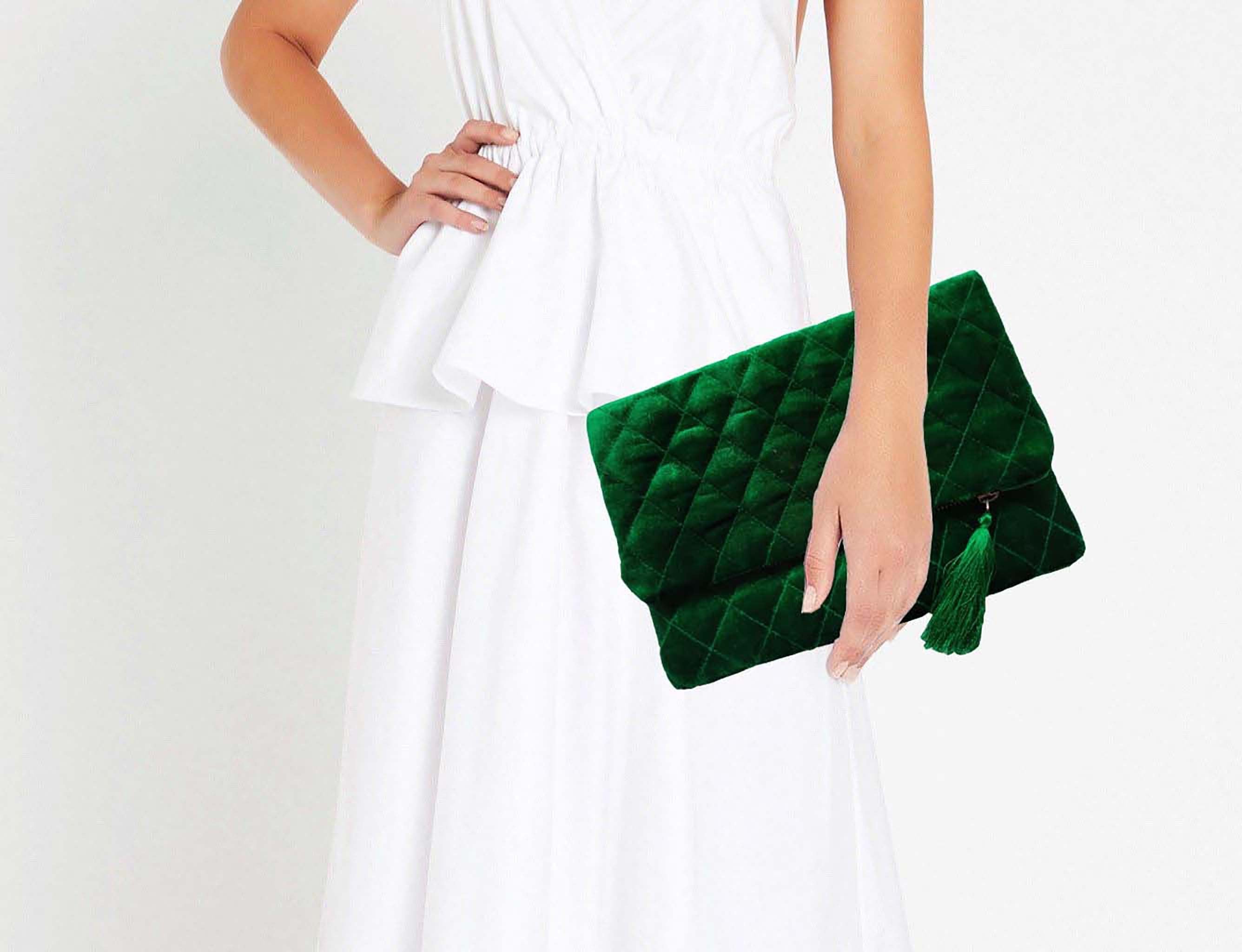 Amore Beaute Crafted from luxe emerald green velvet, this clutch folds over to make it compact and easy to carry.