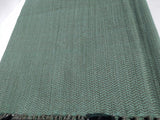 Amore Beaute Soft woolen throw in teal and gray sheep wool yarn woven on a handloom. 