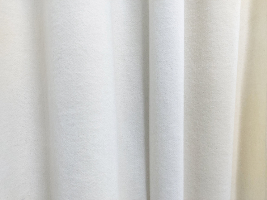 Amore Beaute curtains are crafted from soft felt fabric that is about 2 mm thick.