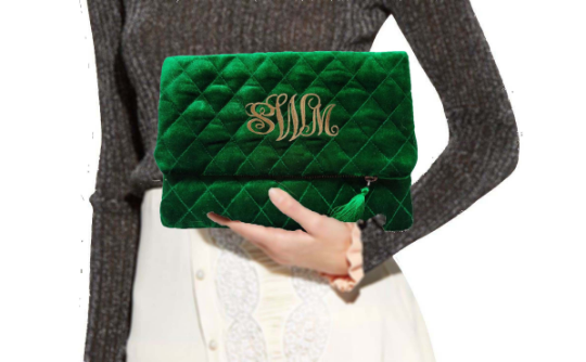 Amore Beaute Crafted from luxe emerald green velvet, this clutch folds over to make it compact and easy to carry.