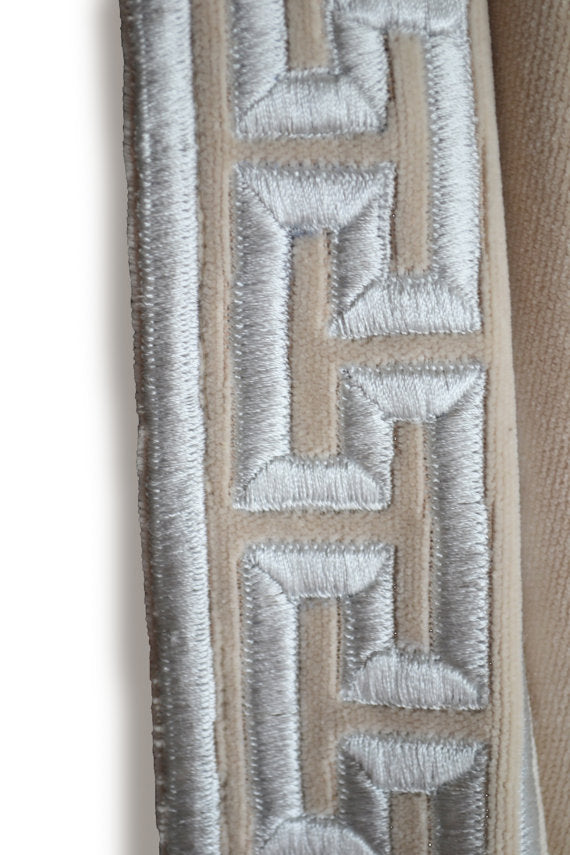 Amore Beaute Oatmeal velvet curtains embroidered with the classic Greek Key pattern in platinum grey embroidery thread.