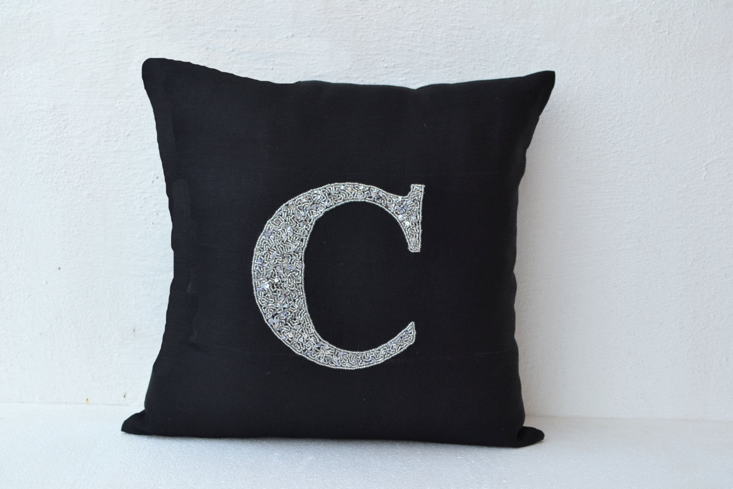 Handmade linen monogrammed throw pillow with metallic silver sequin