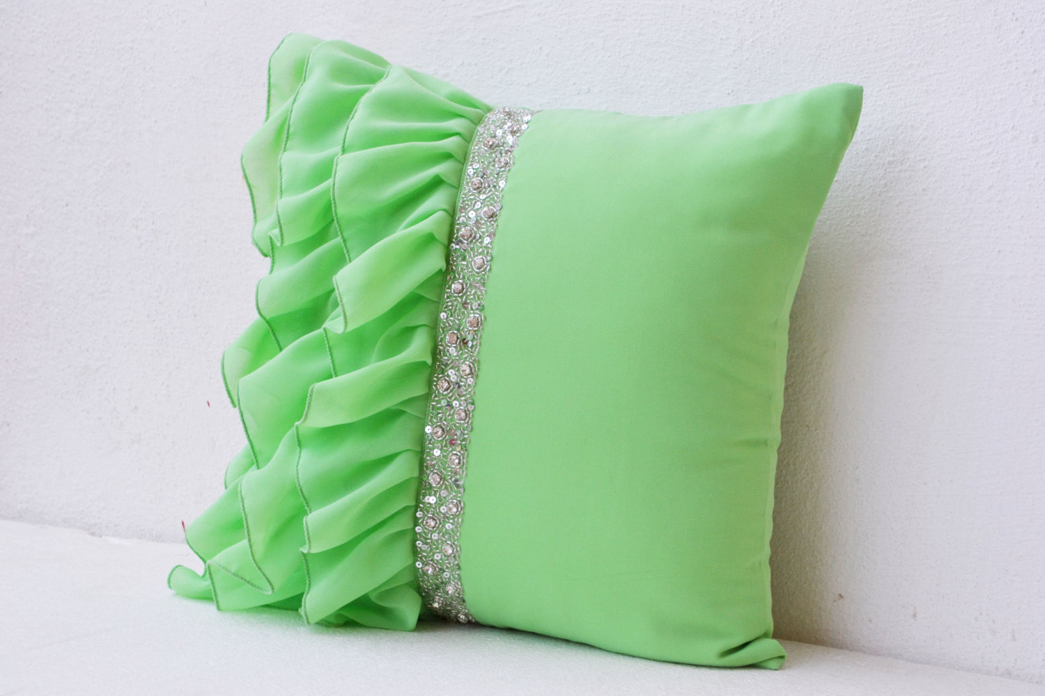 Handmade green throw pillows with ruffles and sequin
