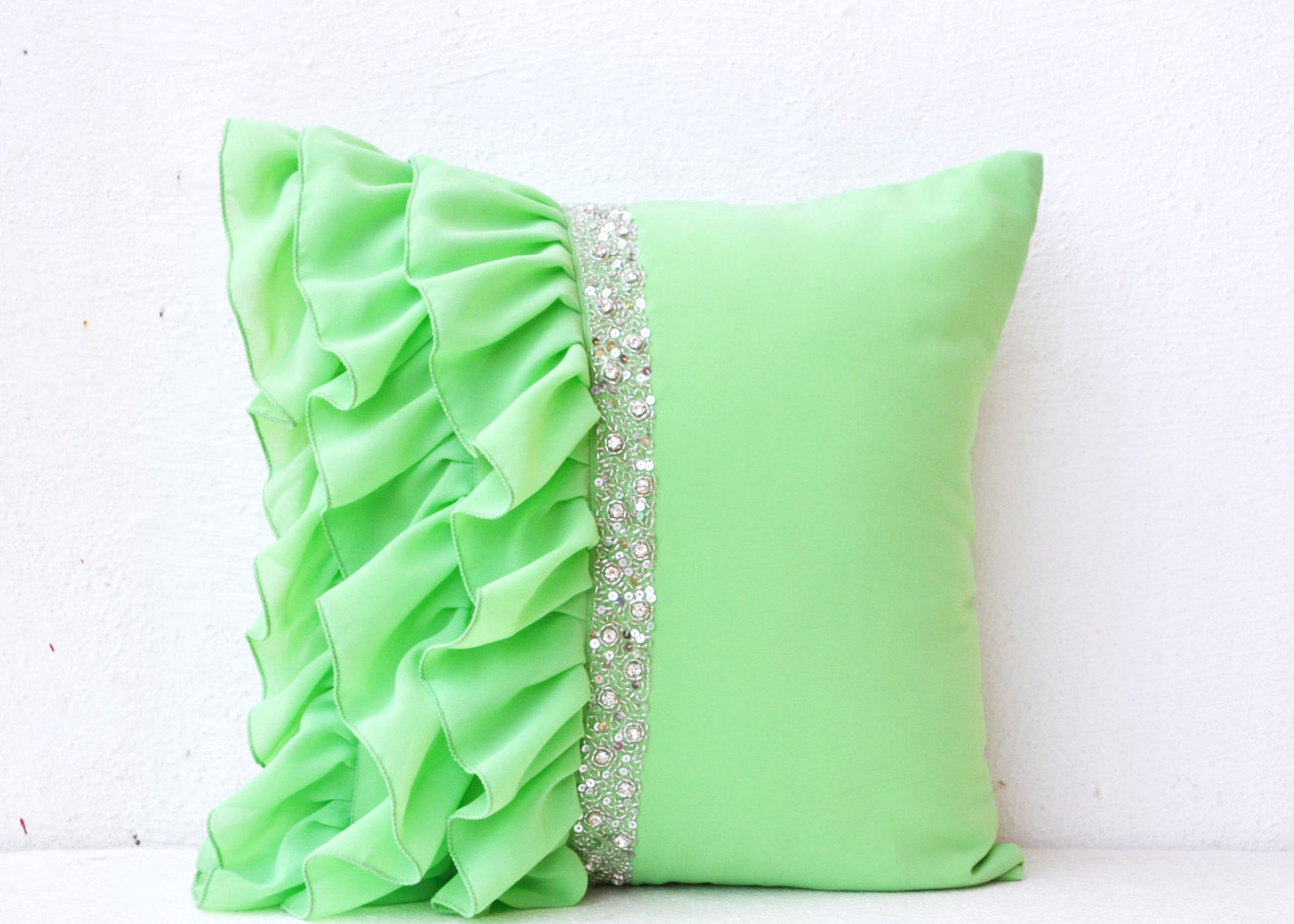 Handmade green throw pillows with ruffles and sequin