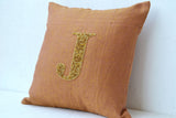 Handmade gold sequin linen cushion with monogram