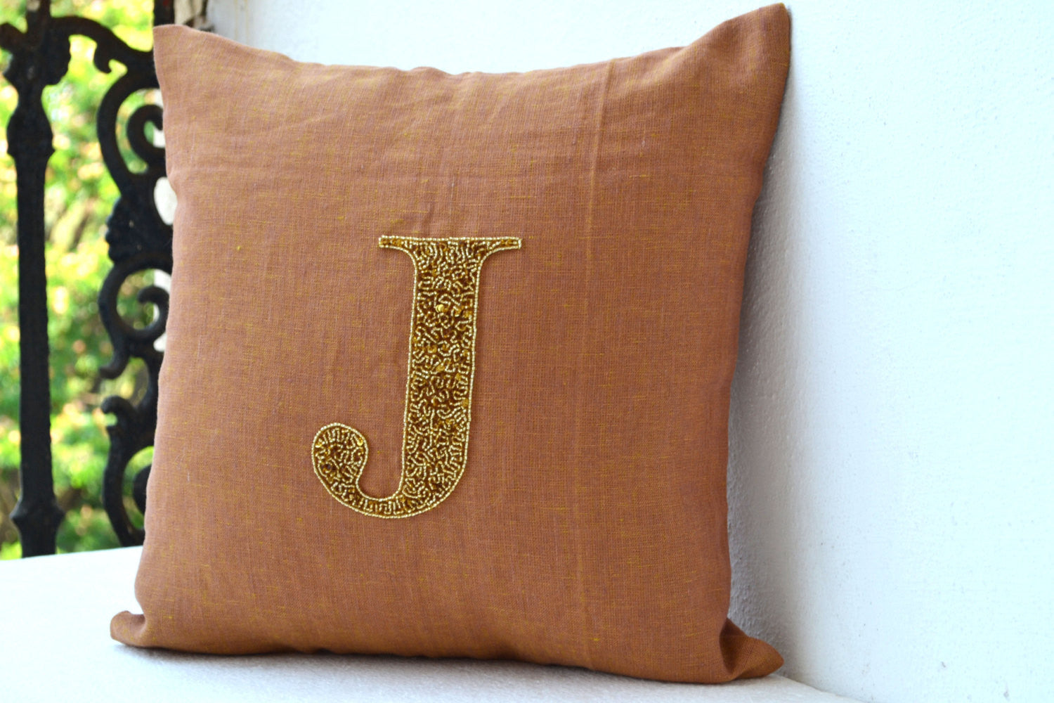 Handmade gold sequin linen cushion with monogram