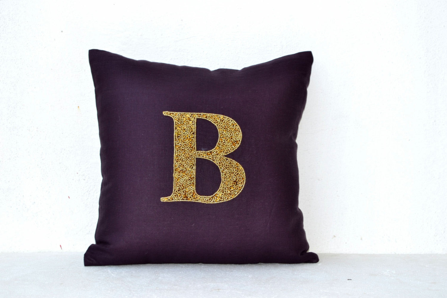 Handmade linen pillows with gold sequin and monogram