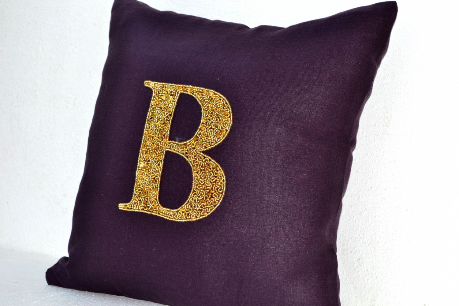 Handmade linen pillows with gold sequin and monogram