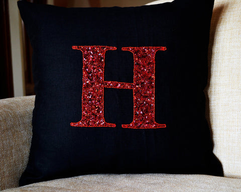 Handmade decorative red pillow cover with monogram and sequin