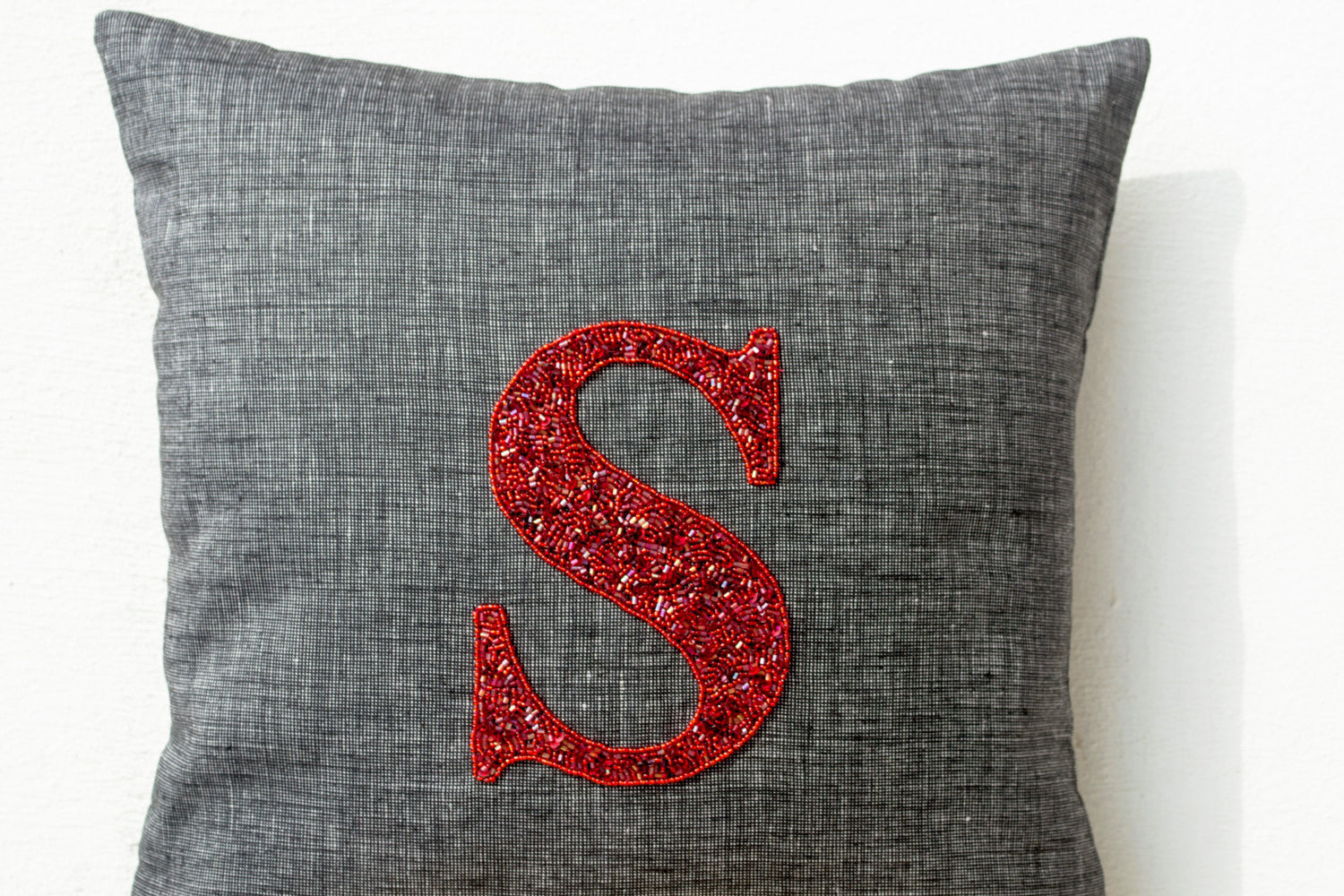 Handmade gray pillow with monogram and gold sequin
