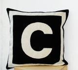 Felt cushion cover with black cream monogram