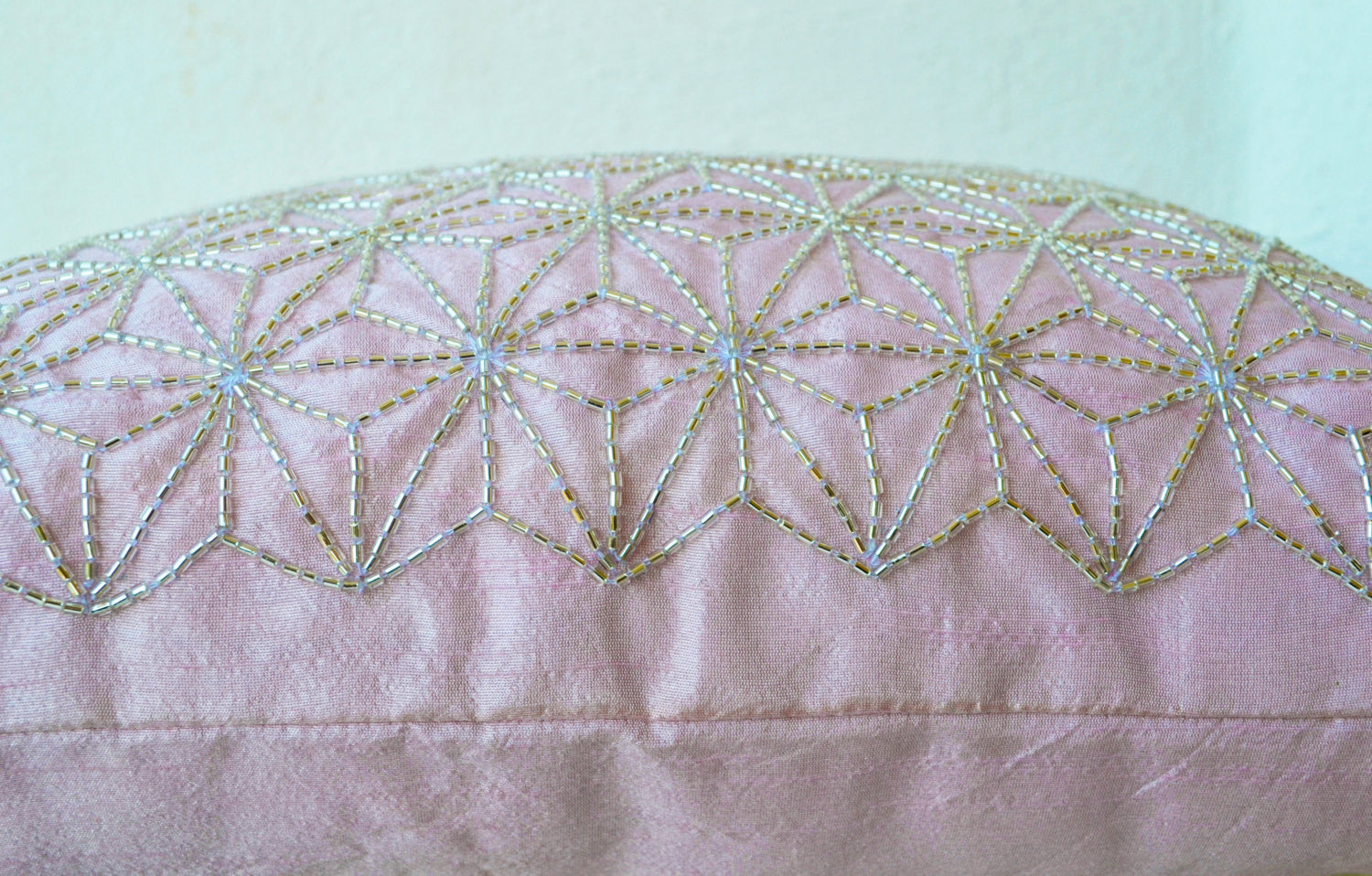 Handmade pink throw pillow with silver embroidery