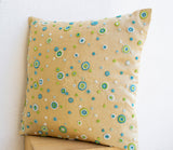 Handmade beige throw pillow with geometric circles design