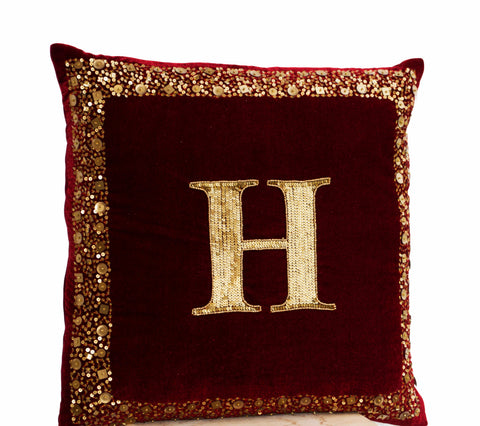 Handmade maroon velvet pillow with monogram and gold sequin