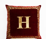Handmade maroon velvet pillow with monogram and gold sequin
